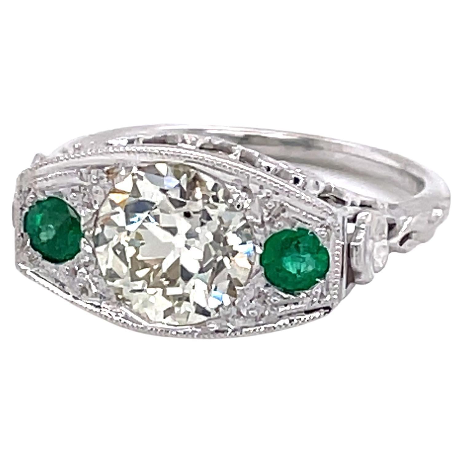 Antique Edwardian Diamond Emerald 18 Karat White Gold Filigree Ring For Sale