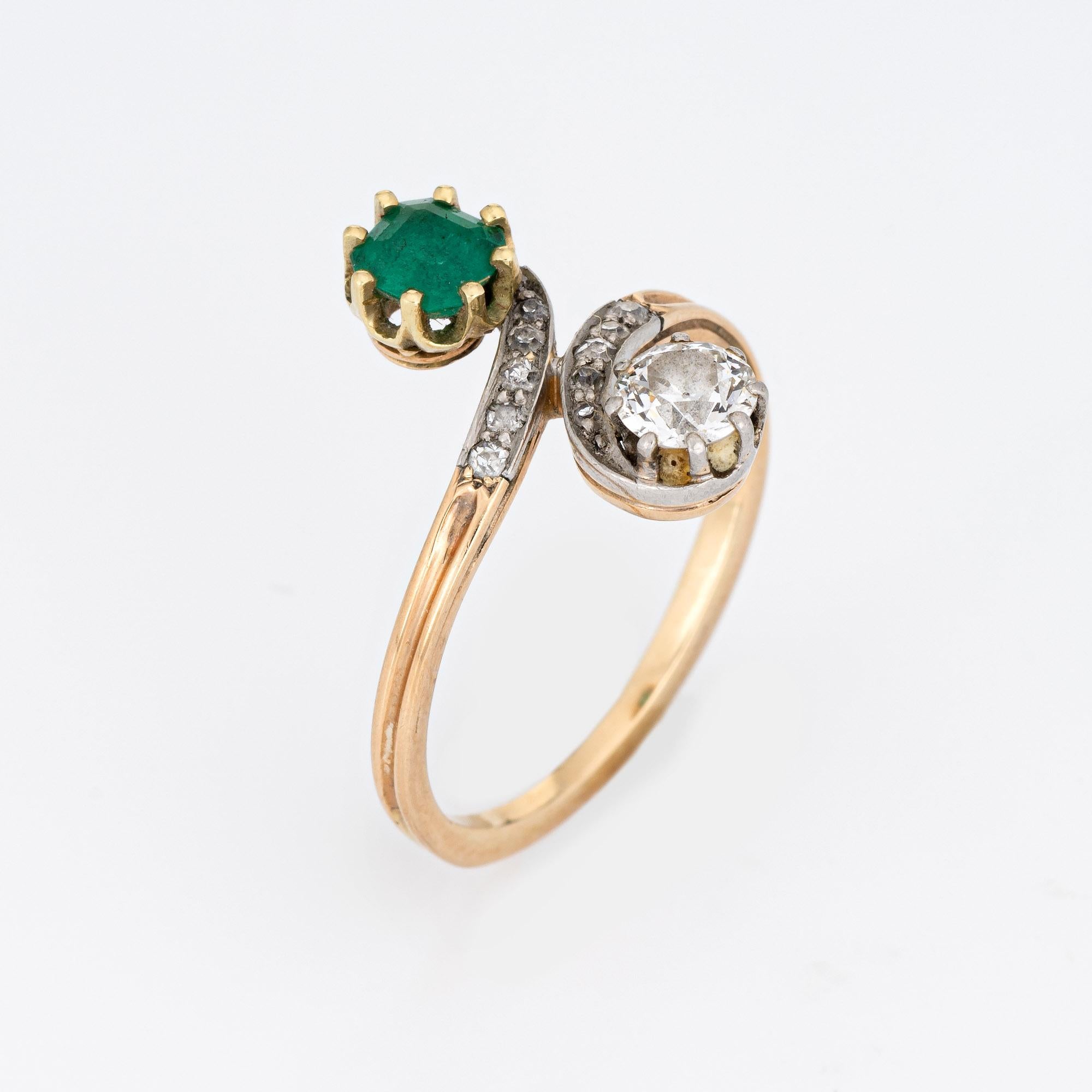 Finely detailed antique Edwardian diamond & emerald 'moi et toi' ring crafted in 14k yellow gold (circa 1910s to 1920s).  

The larger Old mine cut diamond is estimated at 0.40 carats, flanked with a further 9 estimated 0.01 carat old single cut