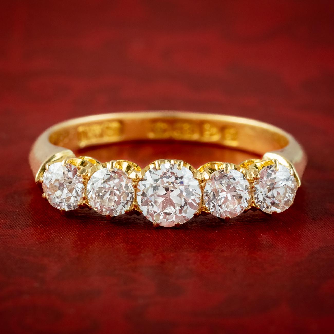 A stunning antique Edwardian five stone diamond ring made in Chester by Edward Durban & Co in 1909. It displays five bright, clean old European cut diamonds with excellent SI1 clarity – H colour that graduate from 0.20 to 0.60ct in the centre
