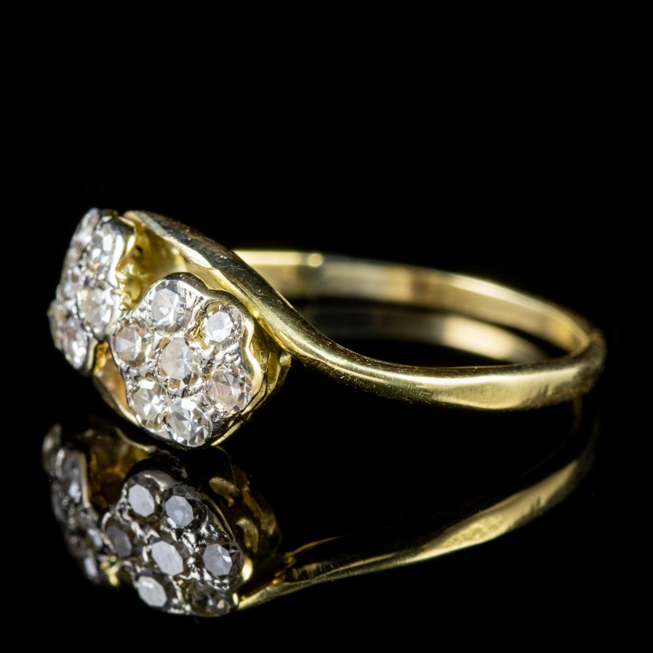 A gorgeous antique Edwardian cluster ring adorned with fourteen Diamonds which add up to approx. 0.40ct set out in the shape of two lovely flowers. 

The Edwardian period was also known as the ‘Beautiful era’ and engagement rings were romantic and