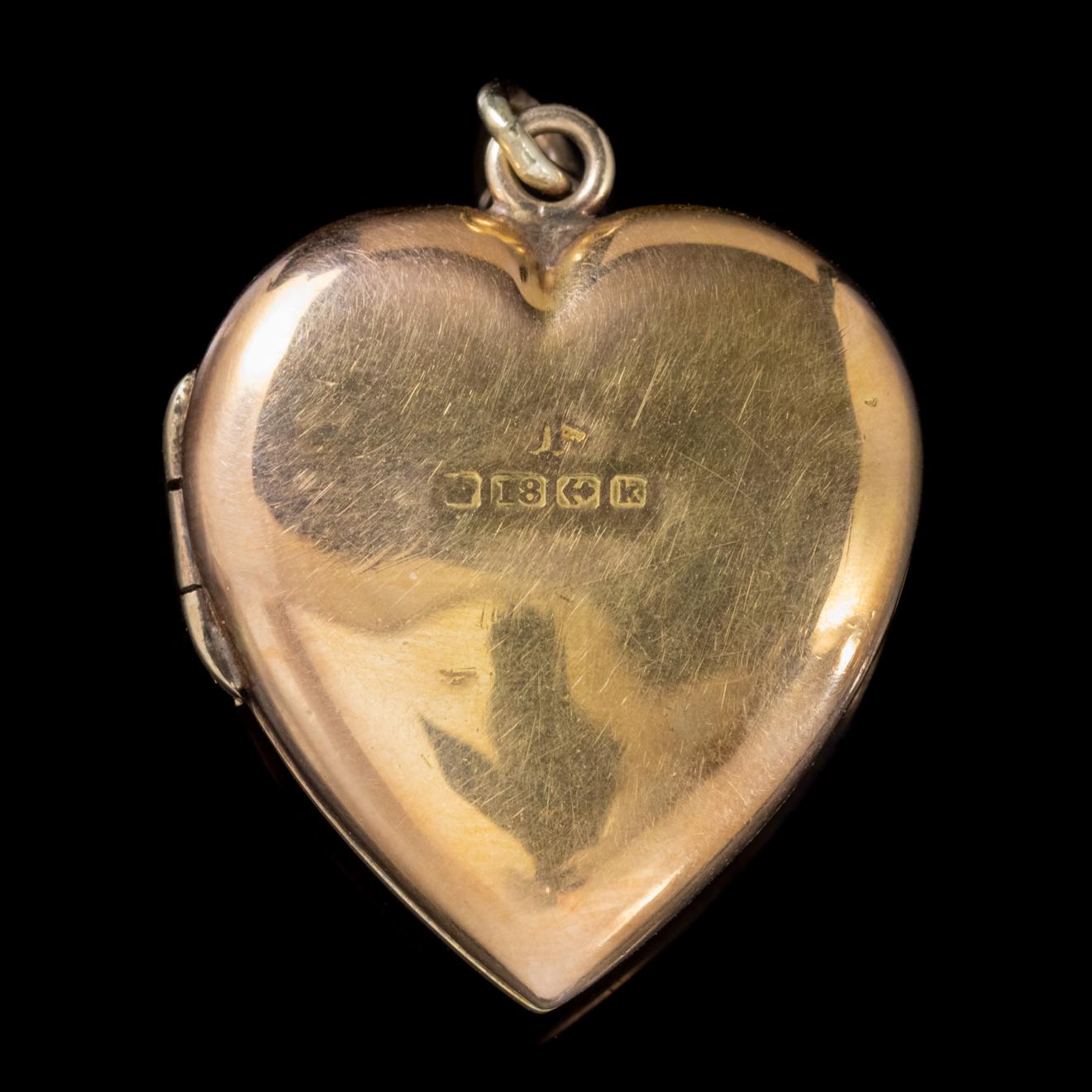 A wonderful Antique Edwardian heart locket featuring a six-pointed star and crescent moon on the front which are set with four approx. 0.08ct old mine cut Diamonds which have a clarity of SI 1 and H colour.

Star and Moon images became popular