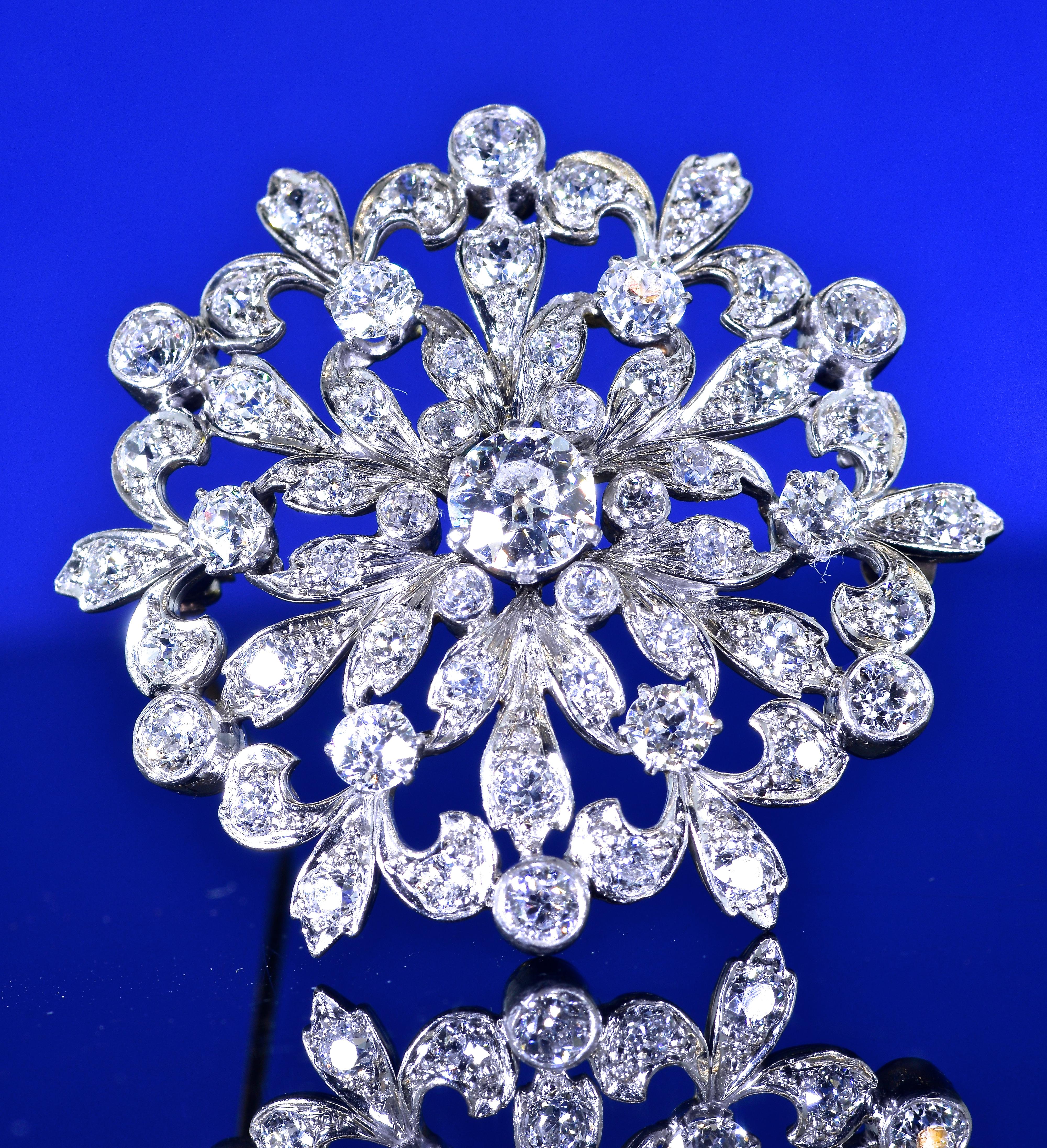 Antique Edwardian diamond pin/pendant possessing very fine diamonds.  This brooch or pendant is one of the better examples of a starburst brooch from this time period. There are 55 well matched European cut diamonds estimated to weigh 3.33 cts. The
