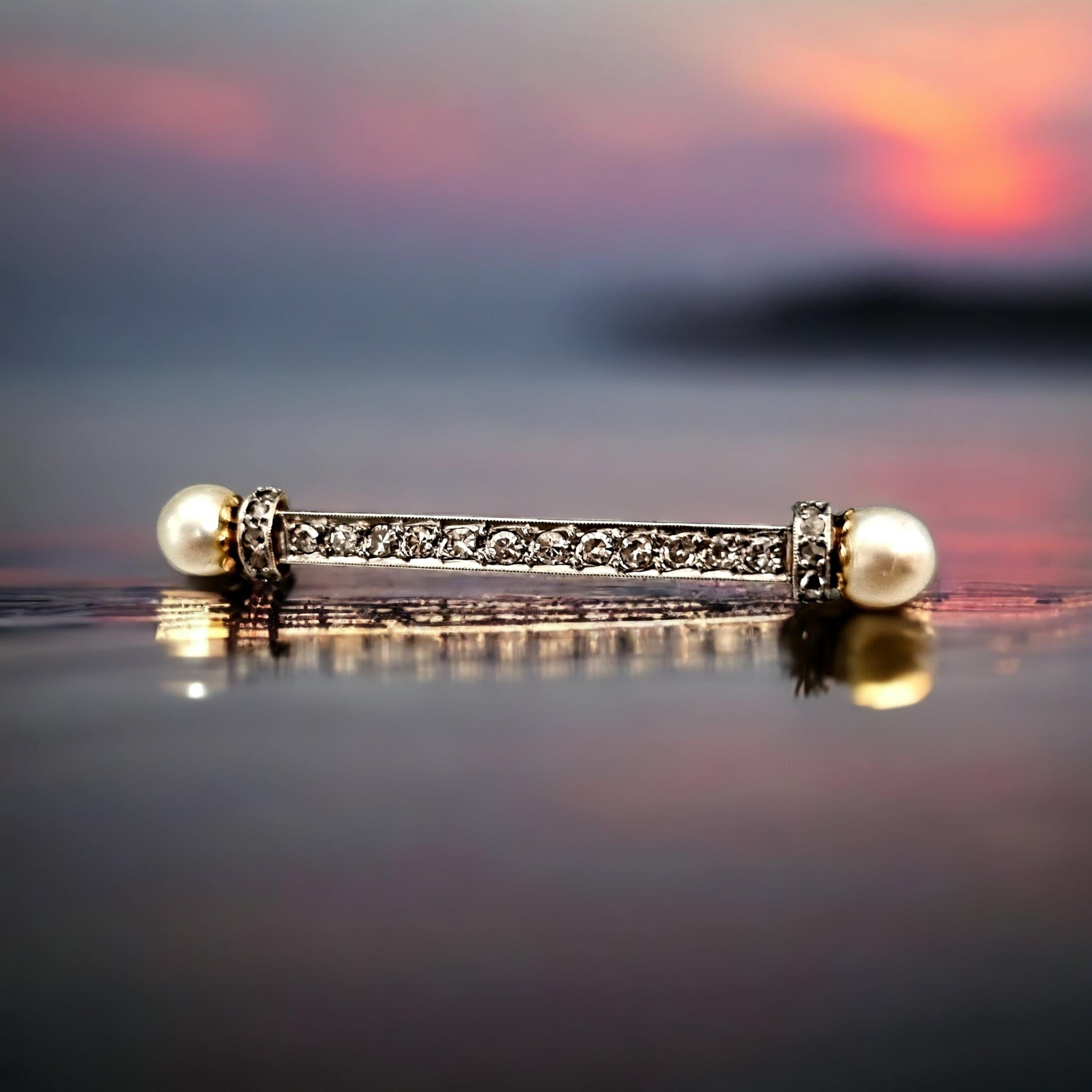 Antique Edwardian  Diamond & Pearl Bar Brooch (1901 - 1914)

The terminals millegrain collet set with two pearls (5.90 and 6.00mm diameter each, not tested and pending certificate) and ten rose cut diamonds, to a tapered bar and with eleven old