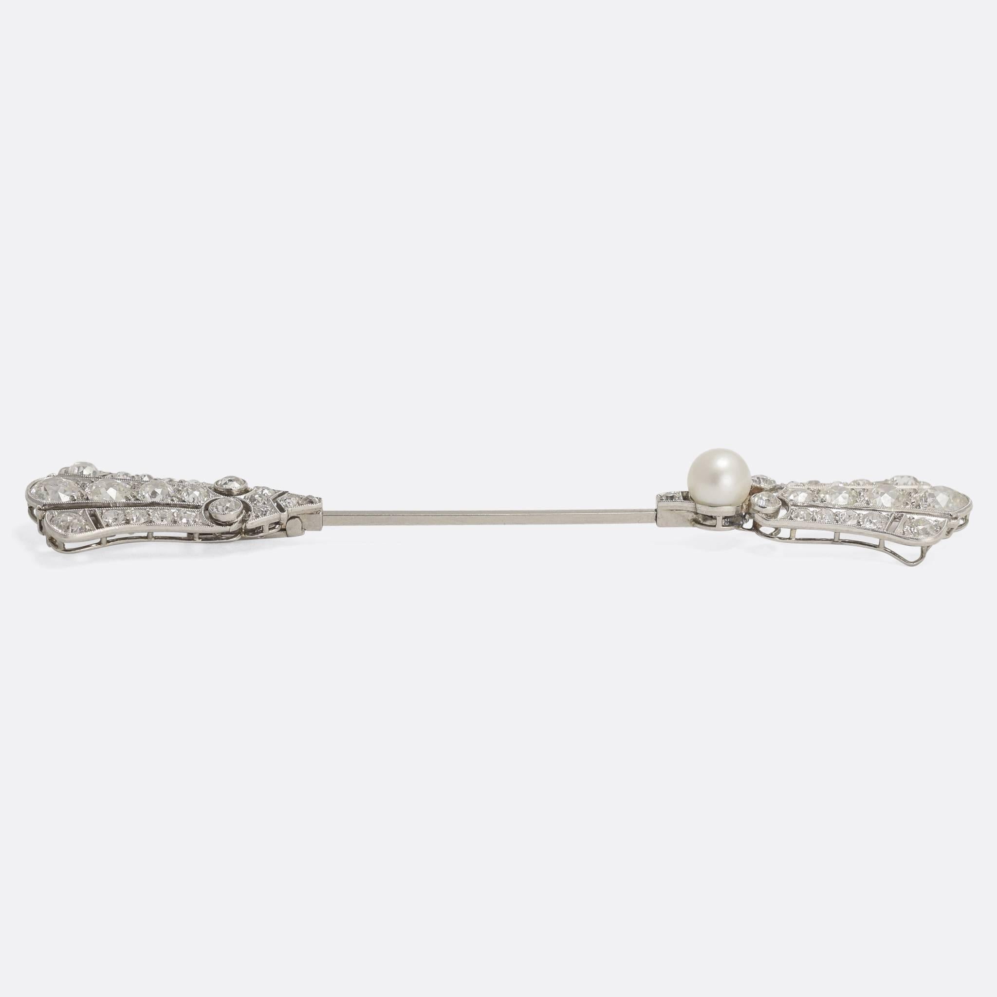 A stunning and extremely high quality French Jabot Pin modelled in Platinum & Gold, set with 4 carats of sparkling transitional cut diamonds and a natural pearl. This particular piece has a very unusual locking mechanism that I have never come