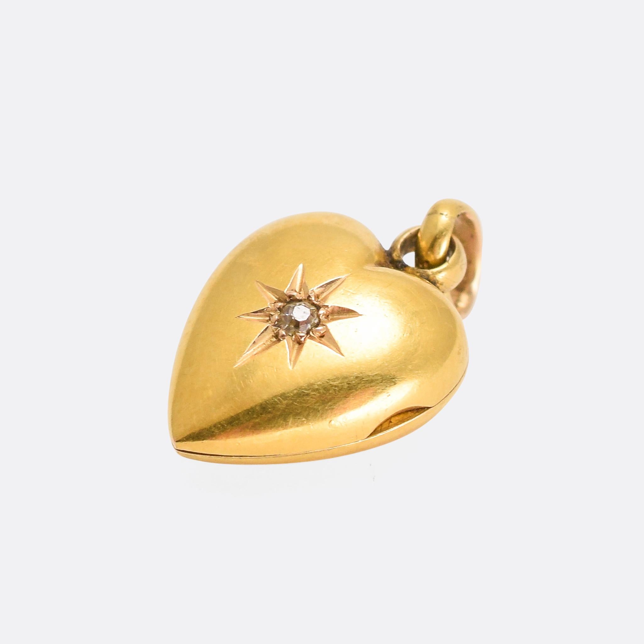 A cute antique puffed heart locket dating from the early 20th Century. It’s set in the centre with a an old cut diamond in a star setting. Modelled in 15 karat gold and complete with the original bail, the piece opens to reveal two locket