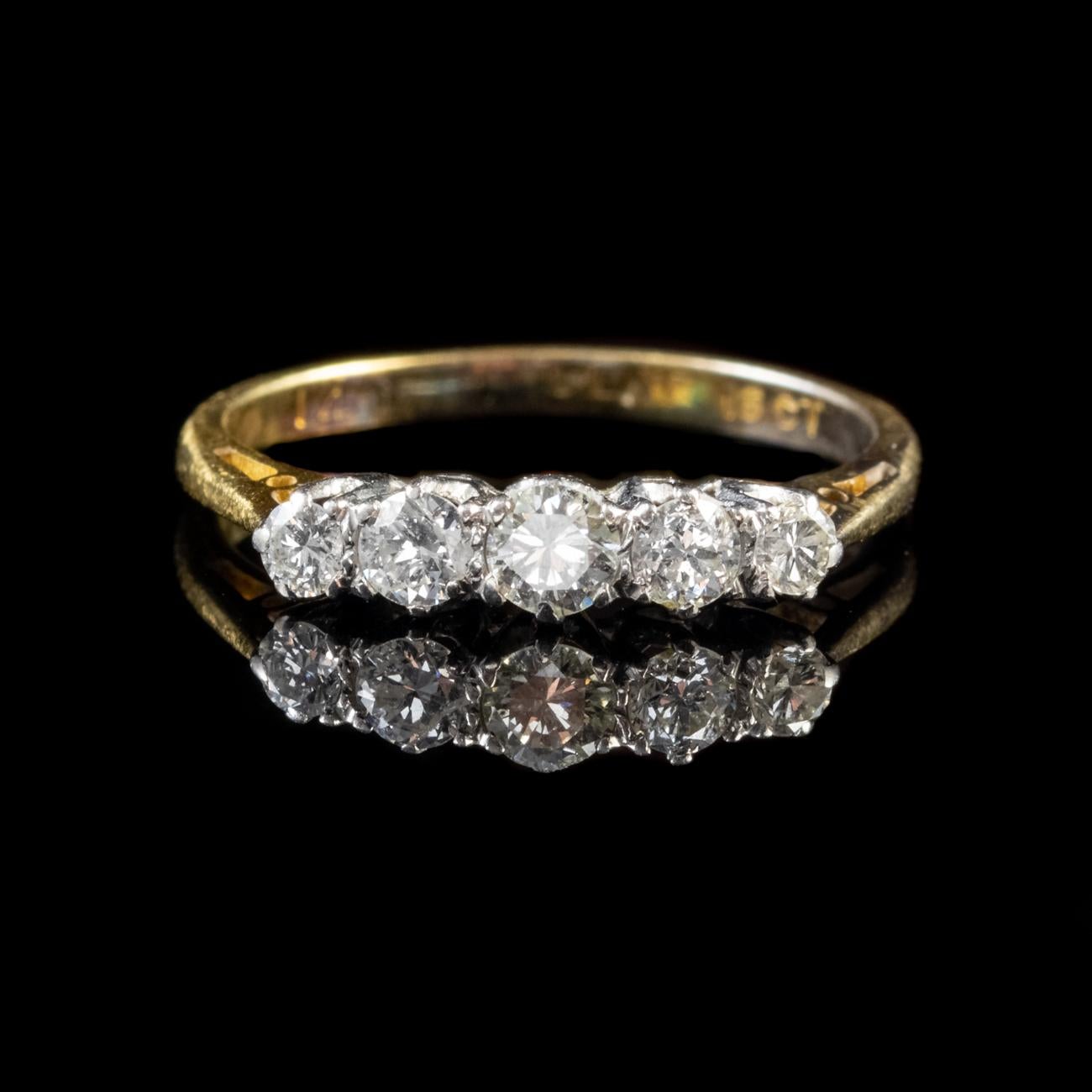 This beautiful Antique Edwardian ring features an 18ct Yellow Gold shank and an ornate Platinum gallery. The gallery is set with five sparkling old cut Diamonds which graduate in size and total 0.75ct.

Diamonds are a stone of perfection. Their