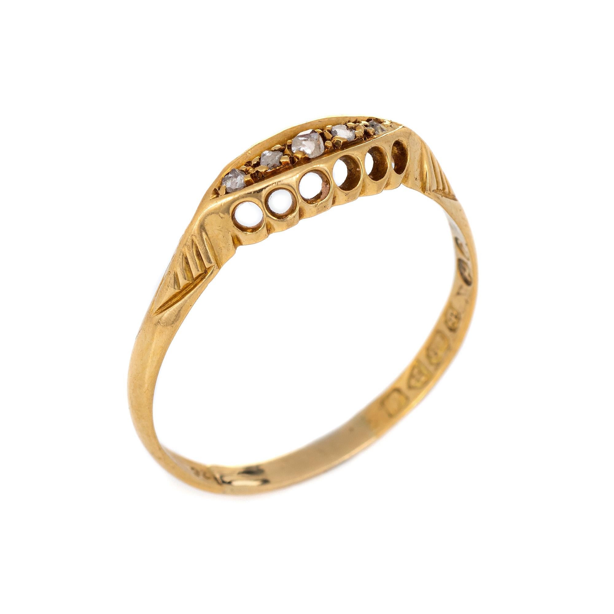 Antique Edwardian band (circa 1909), crafted in 18 karat yellow gold. 

Five old rose cut diamonds total an estimated 0.05 carats (estimated at K color and I1 clarity).   

The old rose cut diamonds are set into a five stone setting with decorative