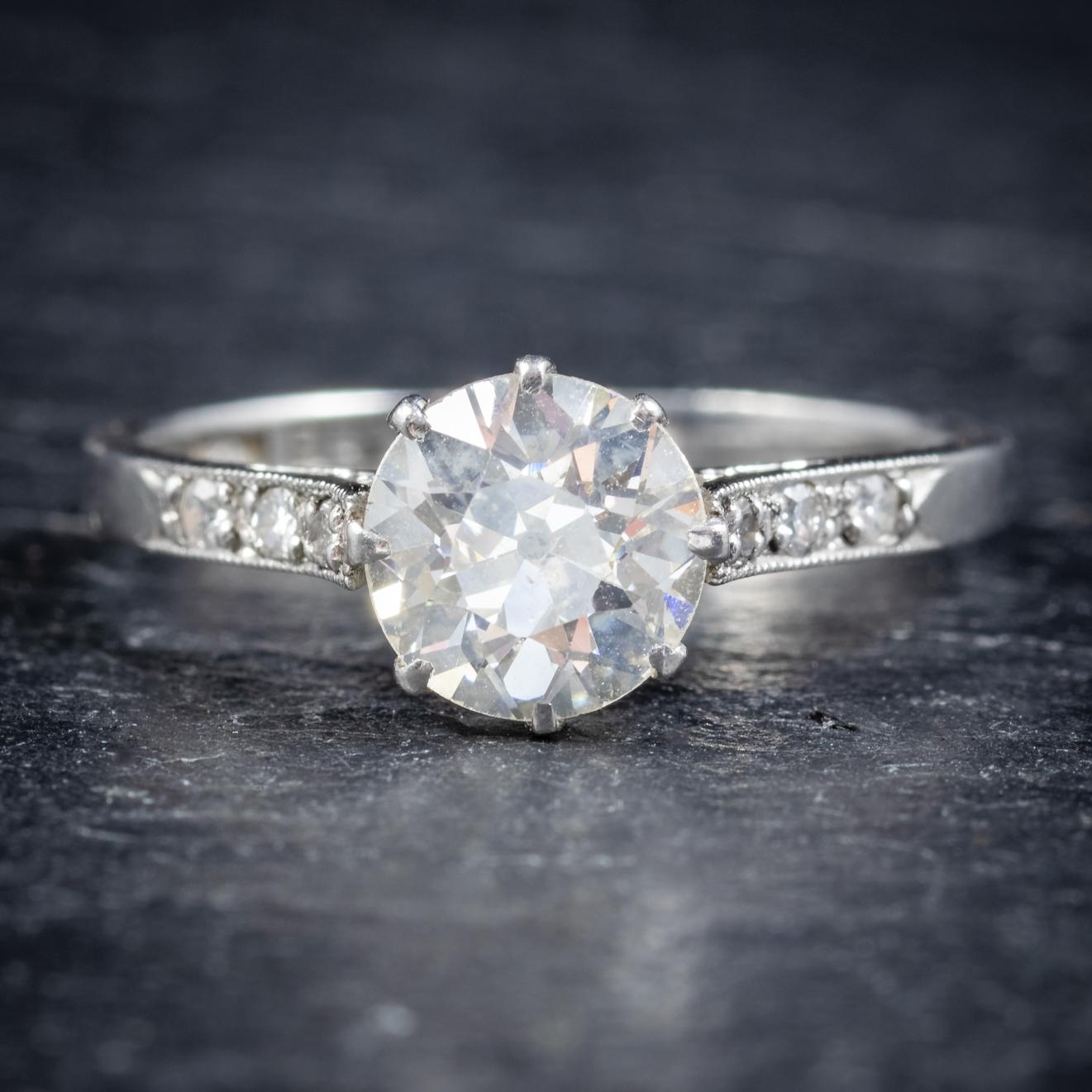 A stunning antique old cut Diamond solitaire ring from the Edwardian era, Circa 1910. 

The central old cut Diamond is an impressive 1.55cts and is - SI1 clarity - H colour. 

Three smaller Diamonds also chase down each shoulder, around 0.12ct in