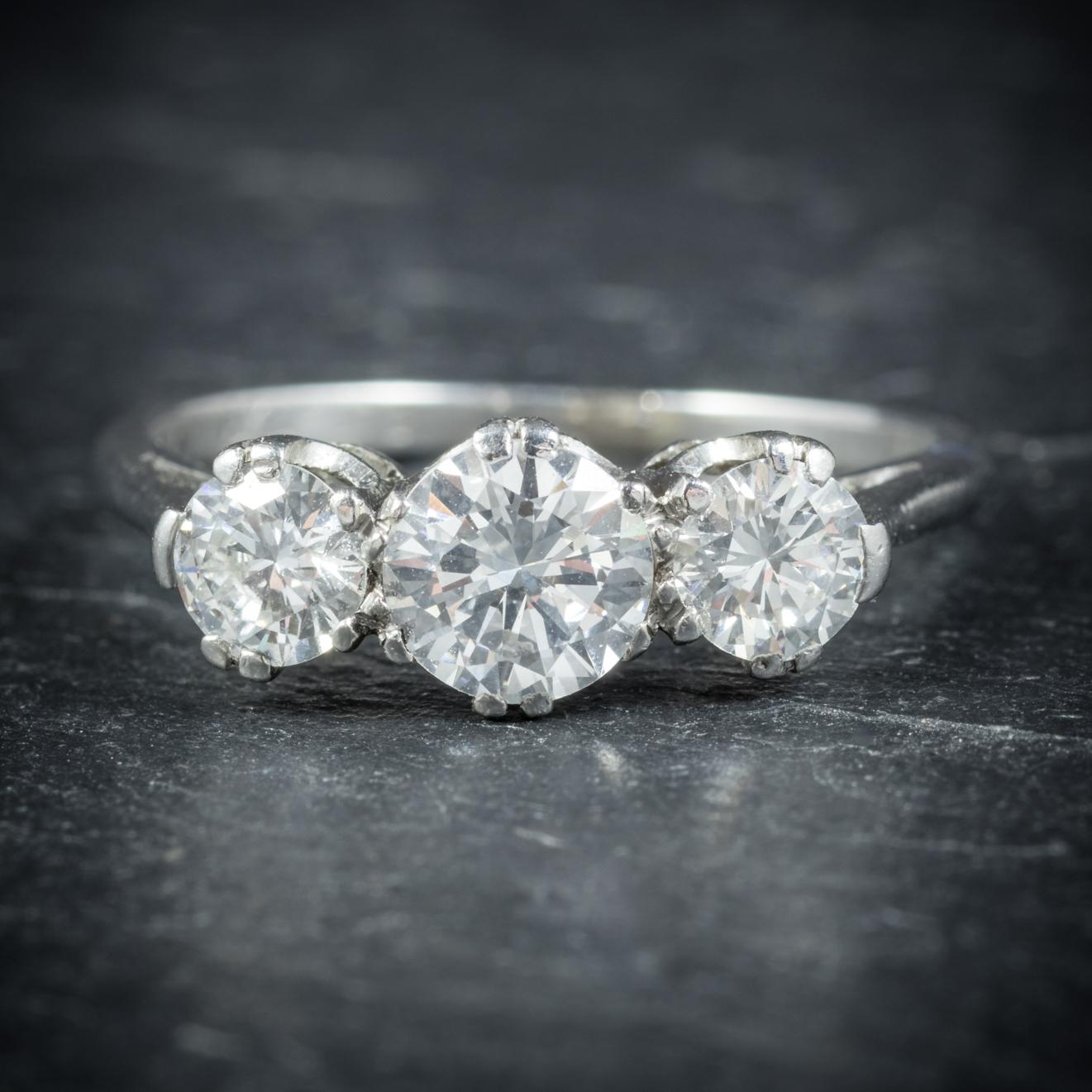 An elegant antique Diamond trilogy Ring from the Edwardian era, Circa 1910

Adorned with a 0.75ct old cut Diamond in the centre flanked by two 0.25ct Diamonds at either side

The Diamonds are VS1 Clarity and H colour and sparkle beautifully in the