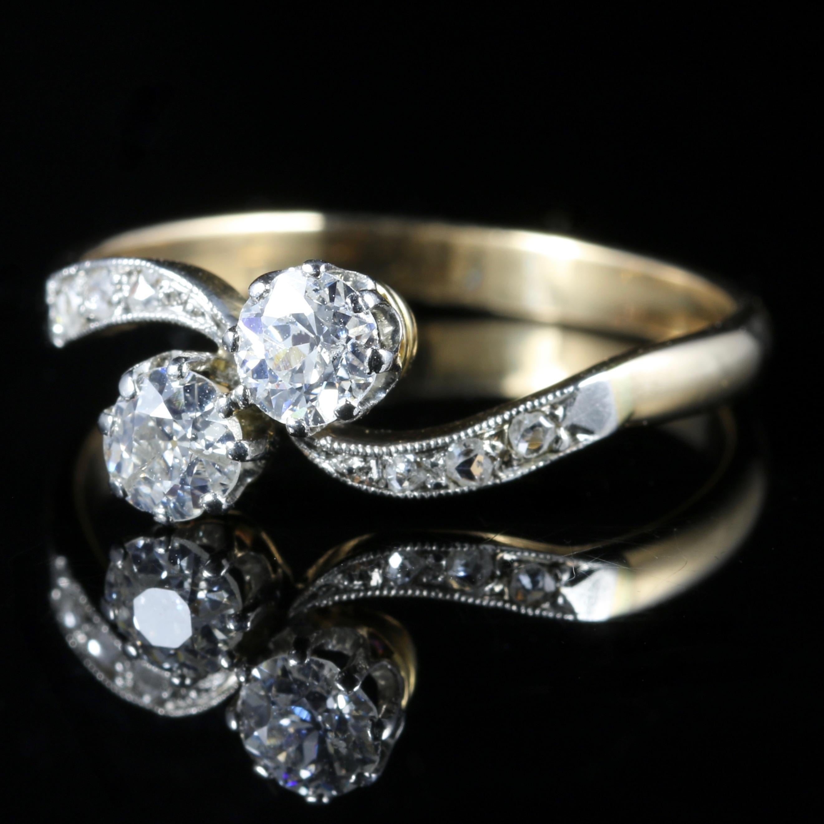 For more details please click continue reading down below...

This gorgeous Antique Edwardian ring boasts two Diamonds in a twist, measuring 0.40ct each in size. Circa 1915

The ring is set in 18ct Gold and Platinum.

The beautiful old cut Diamonds