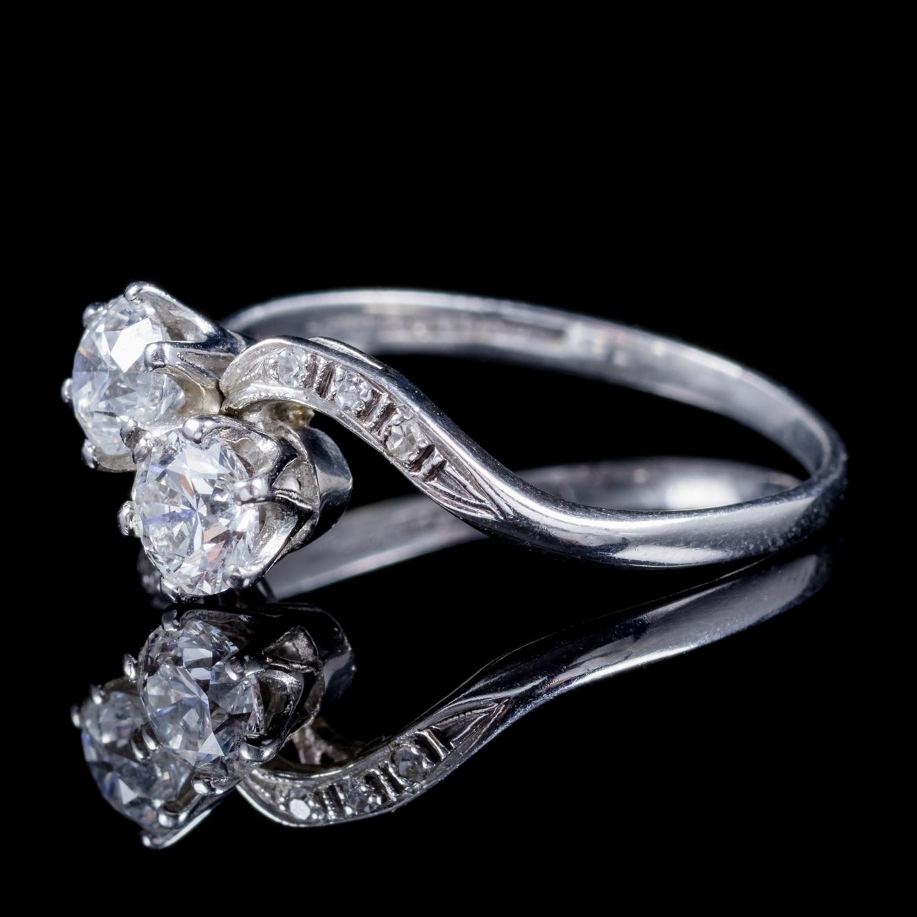 A fabulous antique Edwardian ring Circa 1915, set with two 0.55ct old cut Diamonds with smaller Diamonds chasing down the wonderful twisted gallery.

Old Cut Diamonds are known to Dance by Candle light, beautifully captivating the allure of natures