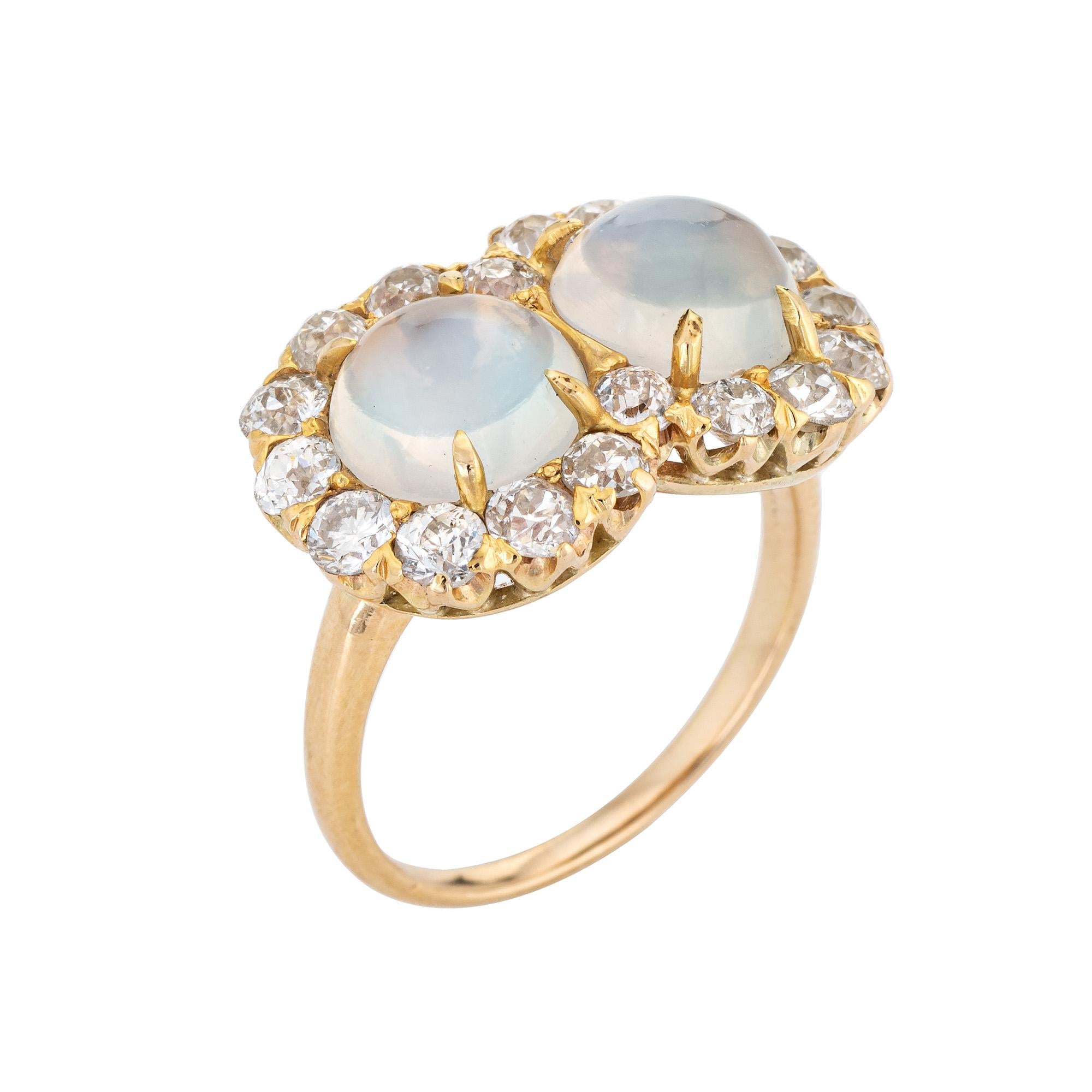 Stylish antique Edwardian moonstone & diamond ring (circa 1900s to 1910s) crafted in 14 karat yellow gold. 

Cabochon cut moonstones each measure 8mm (estimated 3 carats each - 6 carats total estimated weight) accented with 19 estimated 0.12 carat