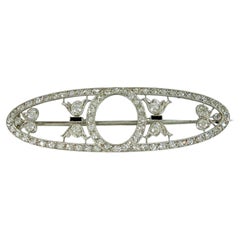 Broche eduardiano de platino de Dreicer & Co. con diamantes y ónix