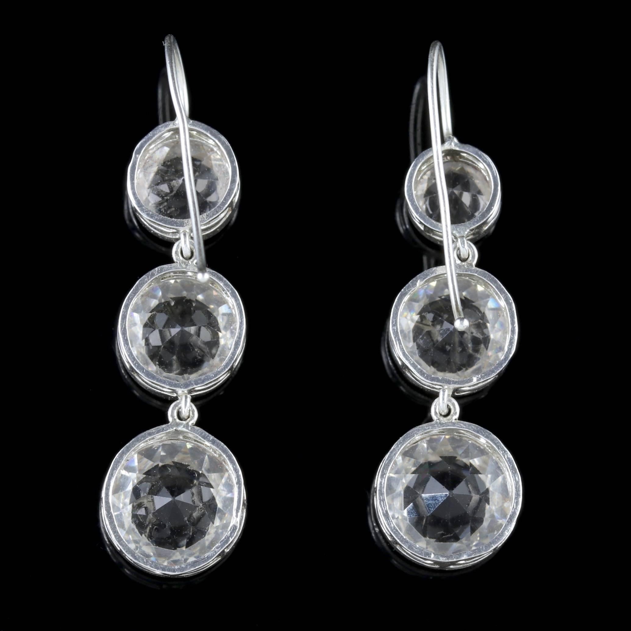 To read more please click continue reading below-

These fabulous long antique Sterling Silver, old cut Paste earrings were made during the Edwardian period, Circa 1915.

Each earring is adorned with three sparkling white, old Cut Paste stones which