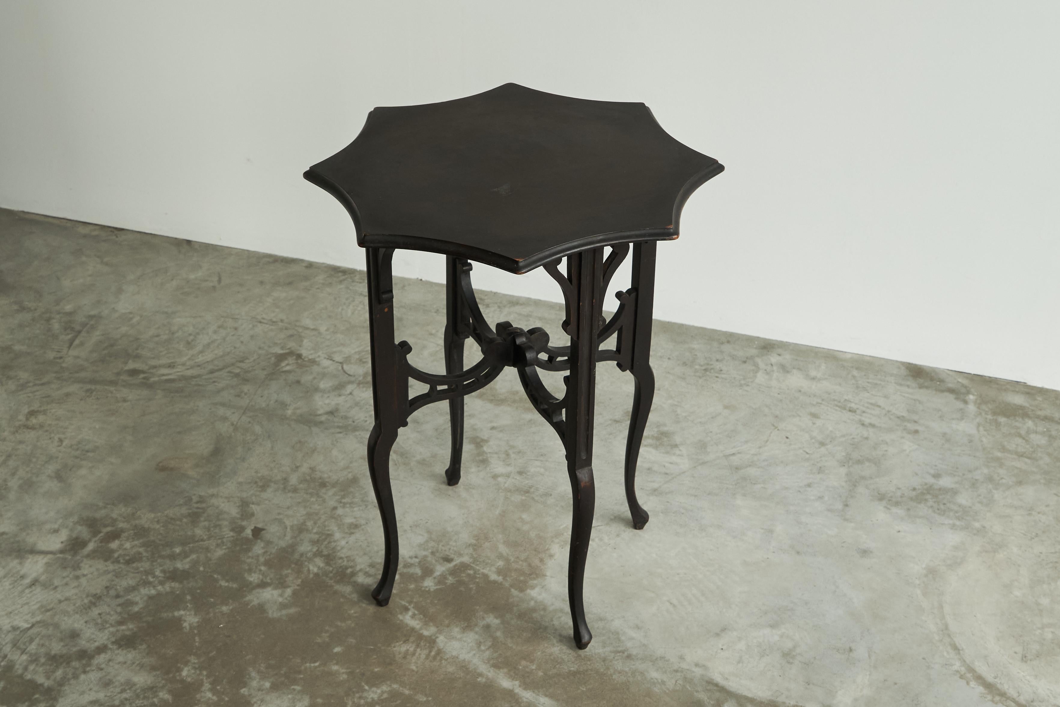 Antique Edwardian Ebonized Arts and Crafts Side Table, United Kingdom, Early 1900's.

This is a very lovely Edwardian arts and crafts inspired side table in ebonized wood. Wonderful elegant design with Eastern influences and a very beautiful shaped