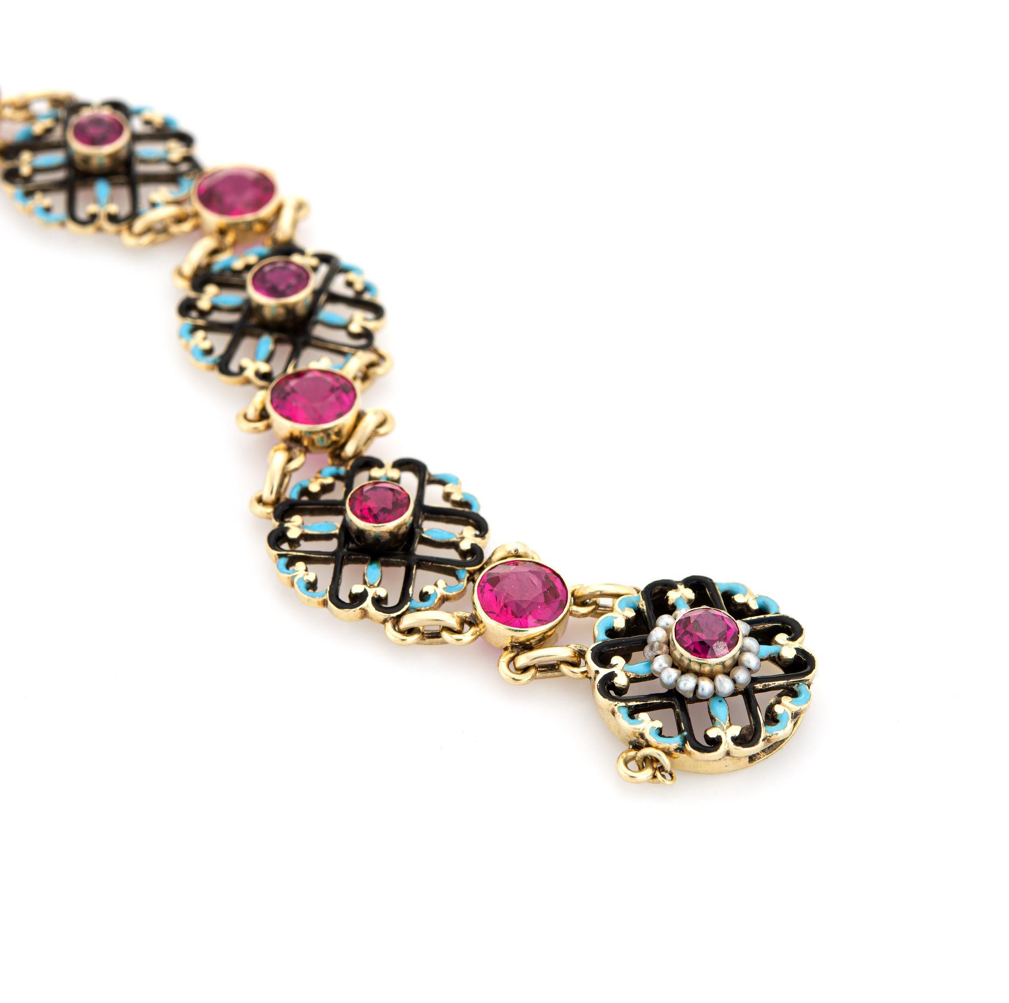 Elegant and finely detailed Edwardian era enamel bracelet (circa 1900s to 1910s), crafted in 14 karat yellow gold.  

Created rubies graduate in size from 4mm to 5mm (in very good condition and free of cracks or chips). Small natural 1mm seed pearls