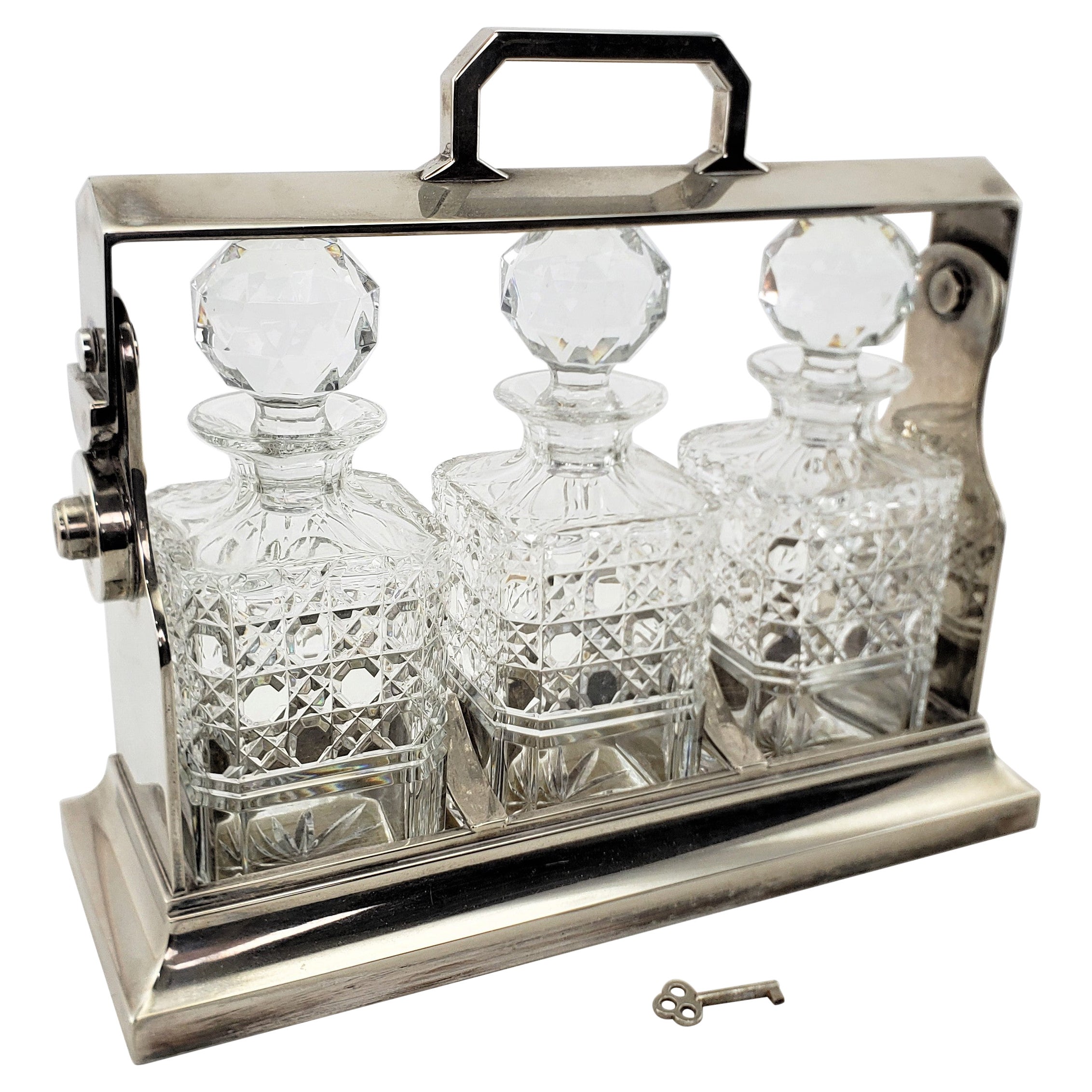 Antique Edwardian English Silver Plated 
Cut Crystal 3 Bottle Tantalus and Key