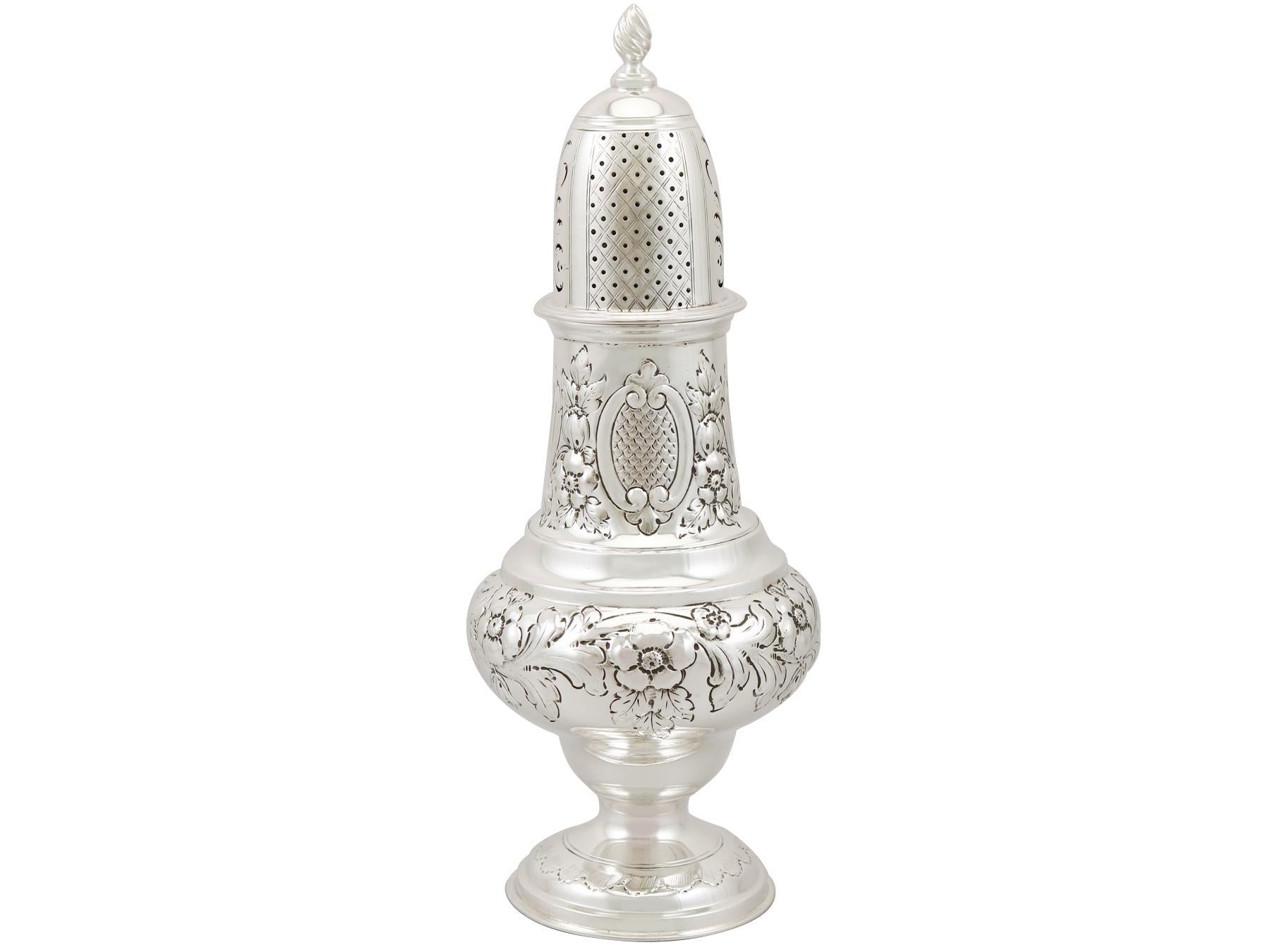 A fine and impressive, large antique Edwardian English sterling silver sugar caster; an addition to our silver teaware collection.

This fine antique Edwardian sterling silver sugar caster has a baluster shaped form onto a spreading domed foot.

The