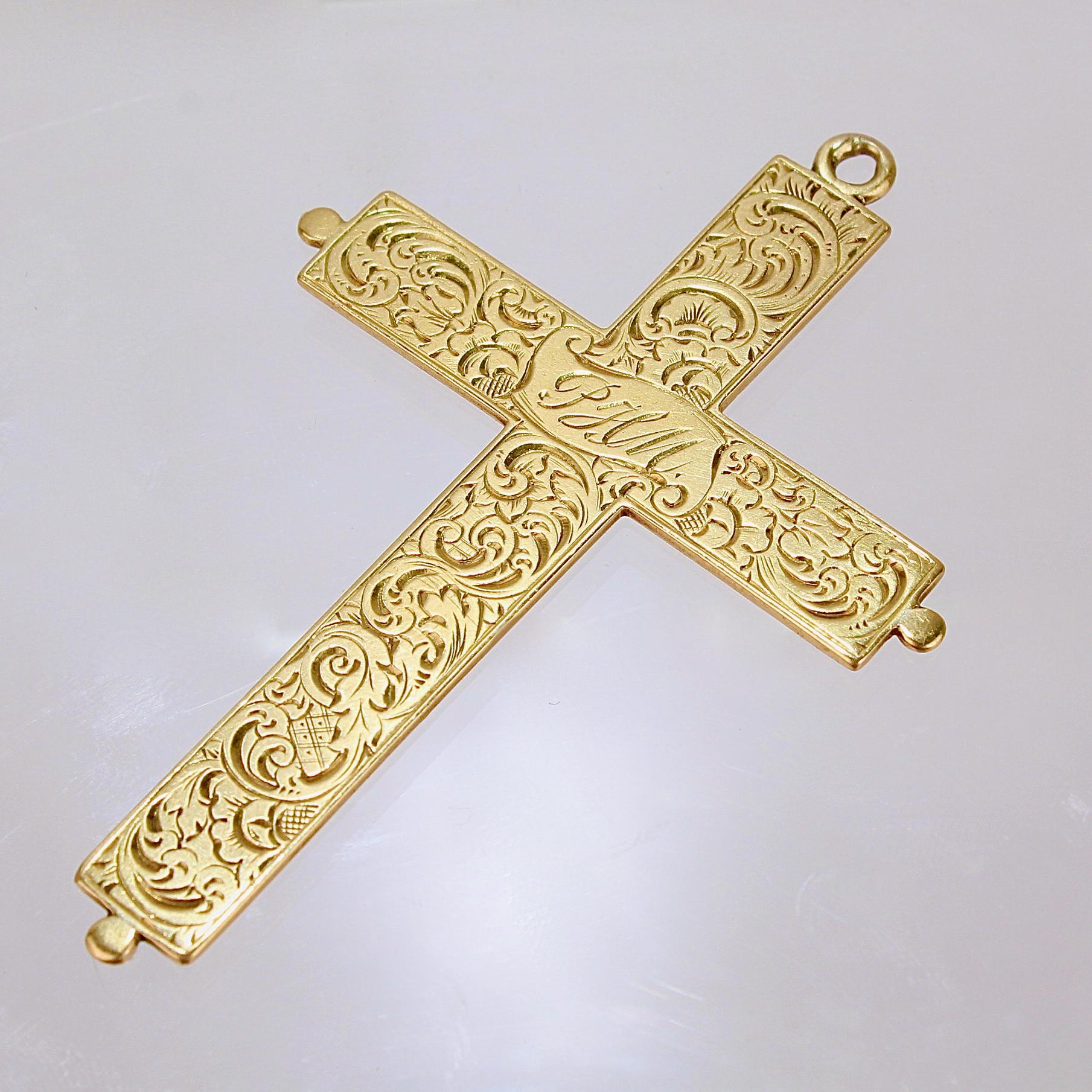 A very fine antique crucifix or pendant cross.

In 14k yellow gold and decoratively engraved to both the front and back. 

The center of each side of the pendant is engraved with initials (PHM and EJM).

Date:
20th century

Overall Condition:
It is