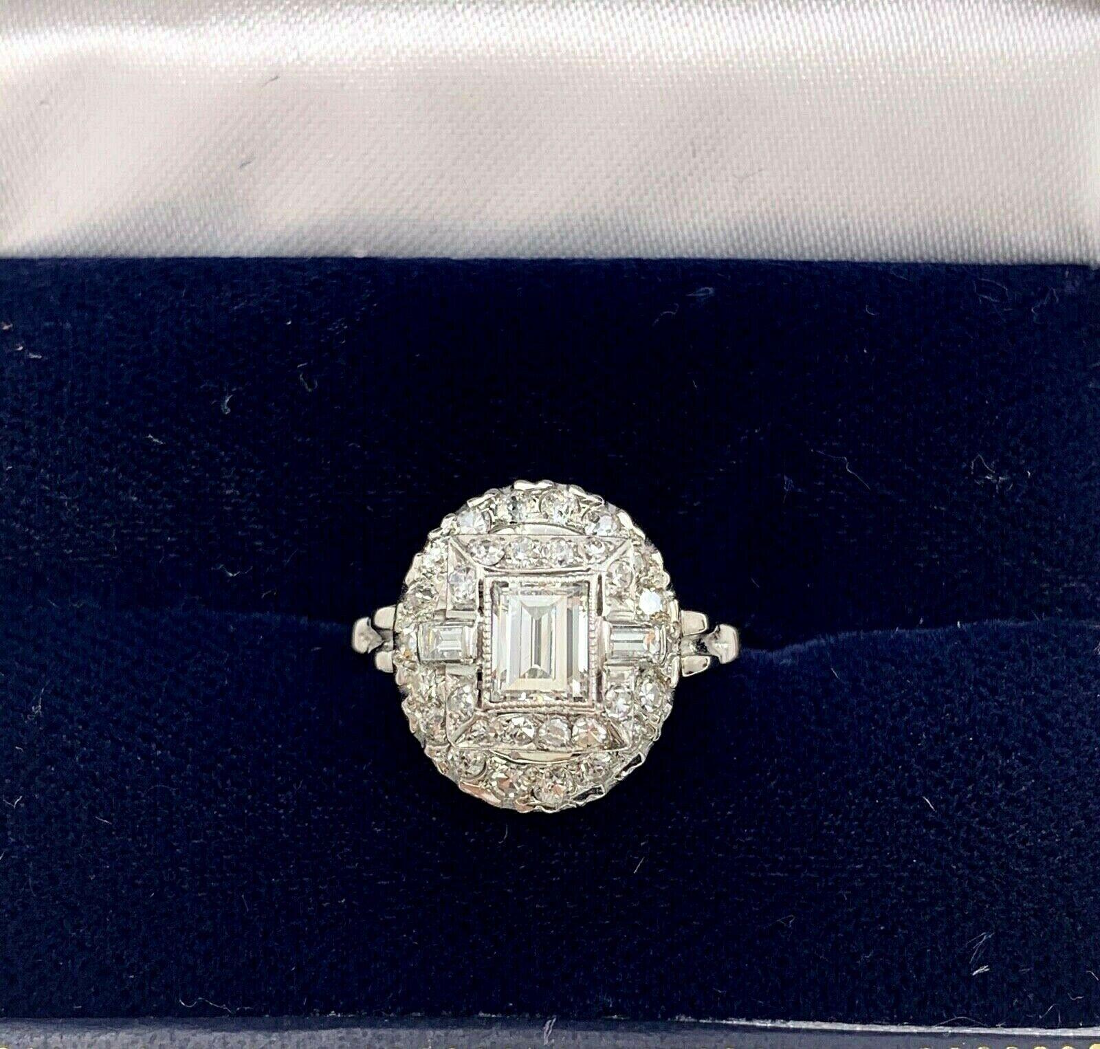Antique Edwardian Diamond Ring
Style:  Refurbished Antique Ring 
Gold:  14K White Gold
TCW:  1.45 Carats Total Approximate
Main Diamond:  .70 Carat Baguette Cut 
Color & Clarity:  G Color,  VS1 Clarity
Accent Diamonds:  30 Single & Old Mine Cut