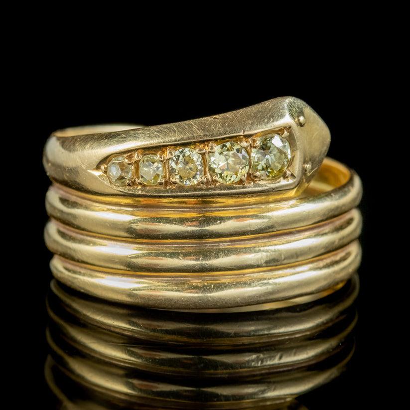 A grand antique snake ring from the early 20th century lined with five old cut fancy diamonds across the head totalling to approx. 0.50ct. Each has a bright golden sparkle and is a wonderful alternative to the more common clear variety.    

It’s