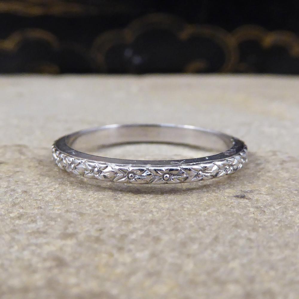 Looking for the perfect fine wedding band? This gorgeous Edwardian band has been made fully from Platinum and shows detailing the full way round creating a sparkly illusion. Due to this antique ring being fine it is able to sit comfortably next to