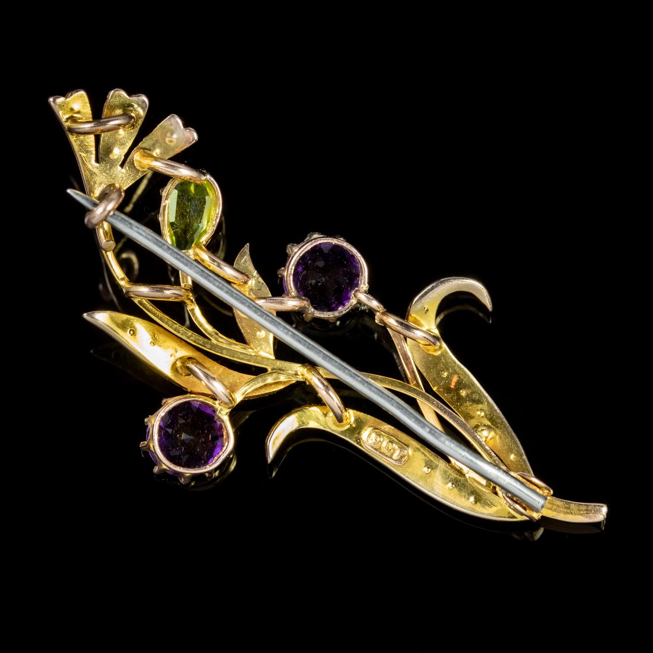 A lovely antique Suffragette brooch from the Edwardian era depicting wonderful flowing leaves and flowers decorated with Amethysts, Peridots and Pearls. 

Suffragettes liked to be depicted as feminine, their jewellery popularly consisted of Violet,