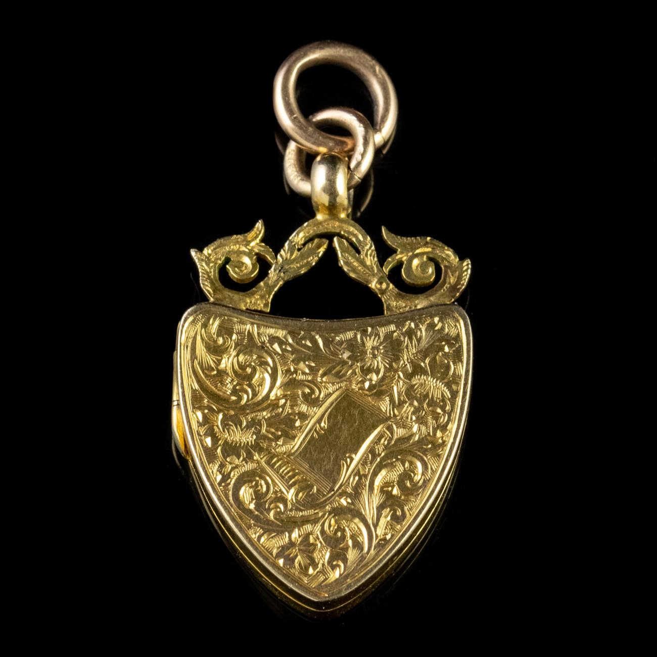 An elegant Antique Edwardian shield shaped locket fashioned in 9ct Yellow Gold and engraved with forget-Me-Nots.

Forget me nots in an old German tale were discovered by two lovers walking by a river one day. After picking a beautiful bouquet of