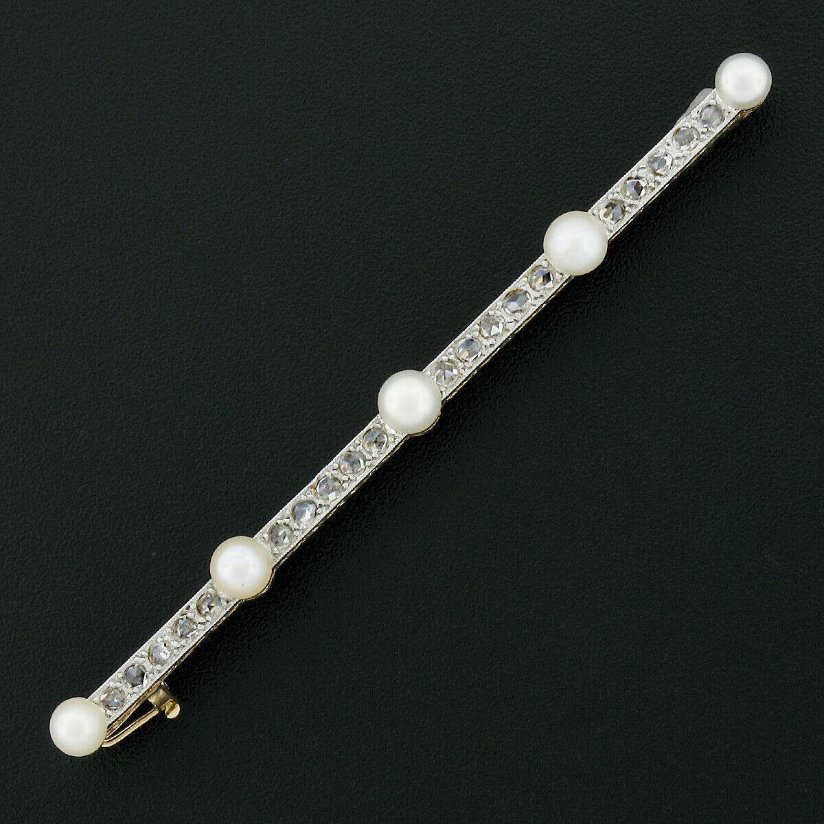This magnificent and classy antique bar pin brooch was crafted in France from solid 18k yellow gold with a solid platinum top that carries fine diamonds and cultured pearls throughout. The lovely pearls are equally spaced across the top and are well