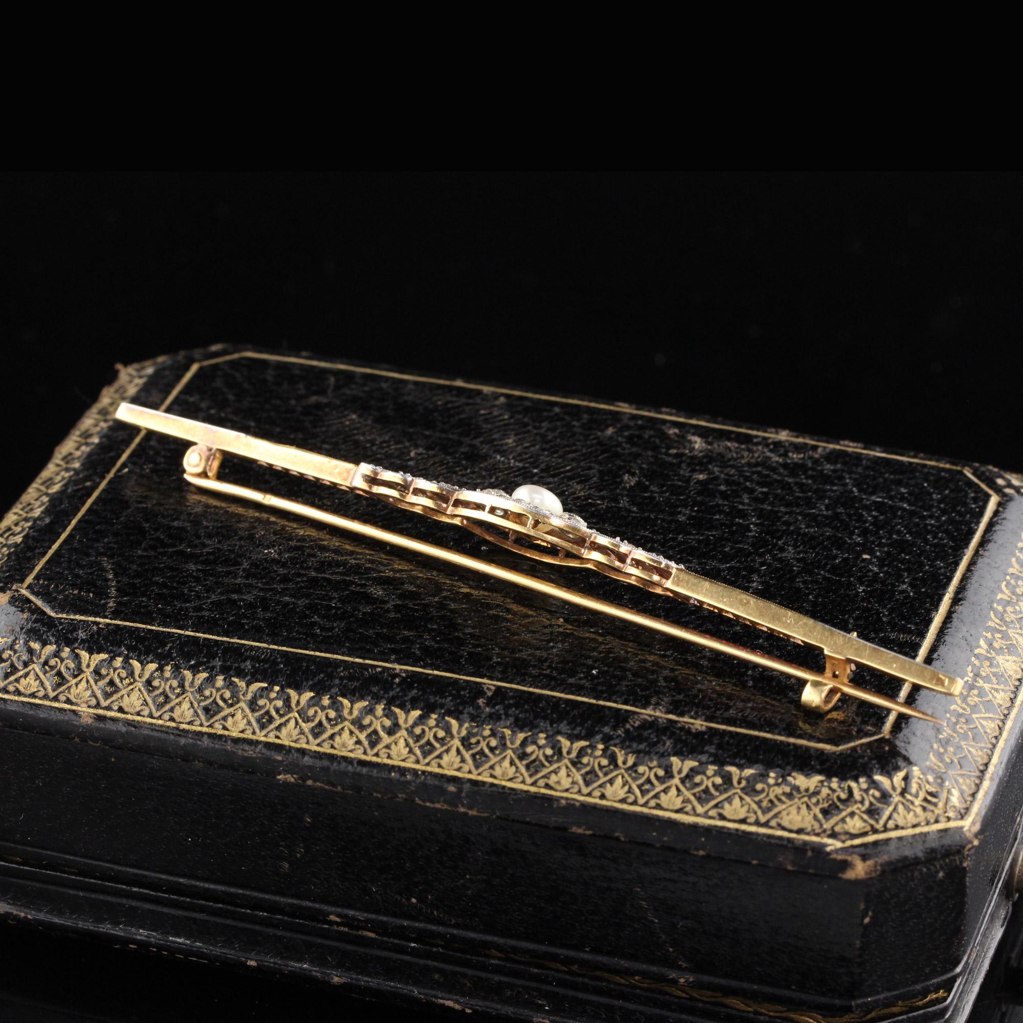 A gorgeous Edwardian bar brooch in excellent condition. Features rubies, rose cut diamonds and a pearl in the center.

Metal: 18K Yellow Gold and Platinum Top

Weight: 6.7 Grams

Diamond Weight: Approximately 0.35 cts

Diamond Color: I

Diamond