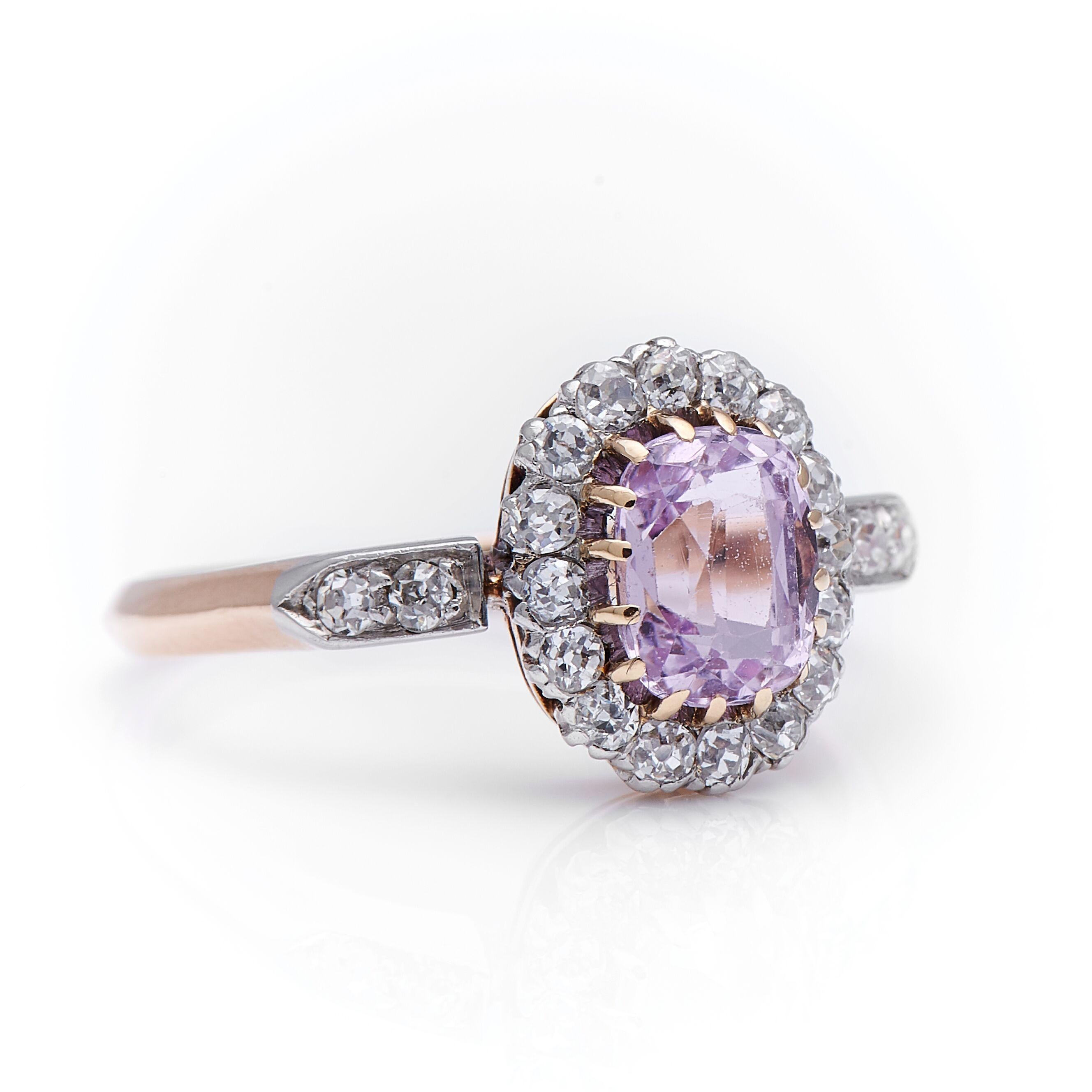 Art Deco, pink sapphire and diamond cluster ring, circa 1920. A very pretty pink sapphire centre with a delicate old-cut diamond surround all set in platinum style claw setting. The sapphire is vibrant shade of pink, a wonderful contrast to the