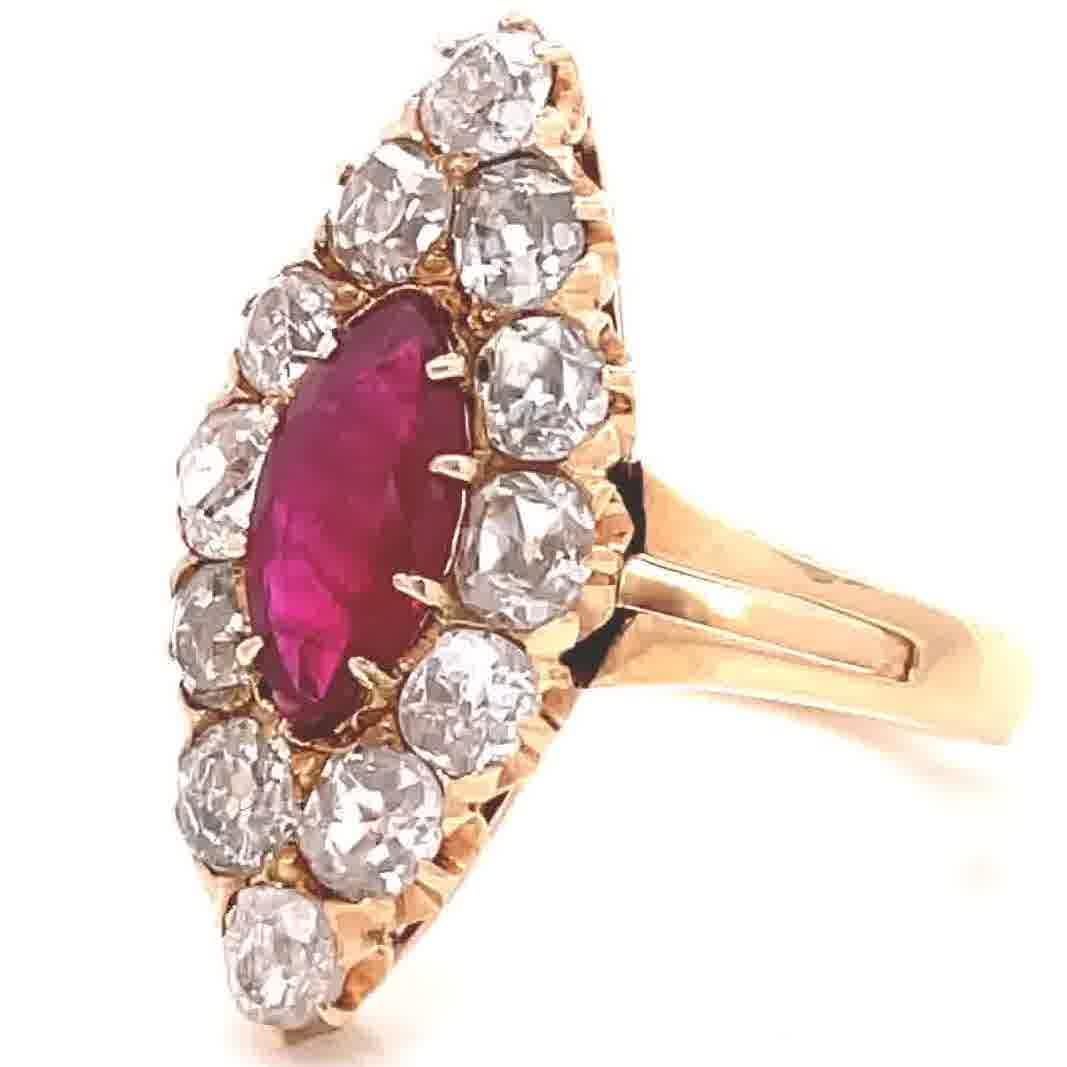 Are you looking for a one of a kind ring with antique history? A ring that will always belong in a palace? Feel yourself like royalty watching The Crown while wearing this beauty. Antique Edwardian GIA Burma Ruby Damond Cluster Navette Ring. The