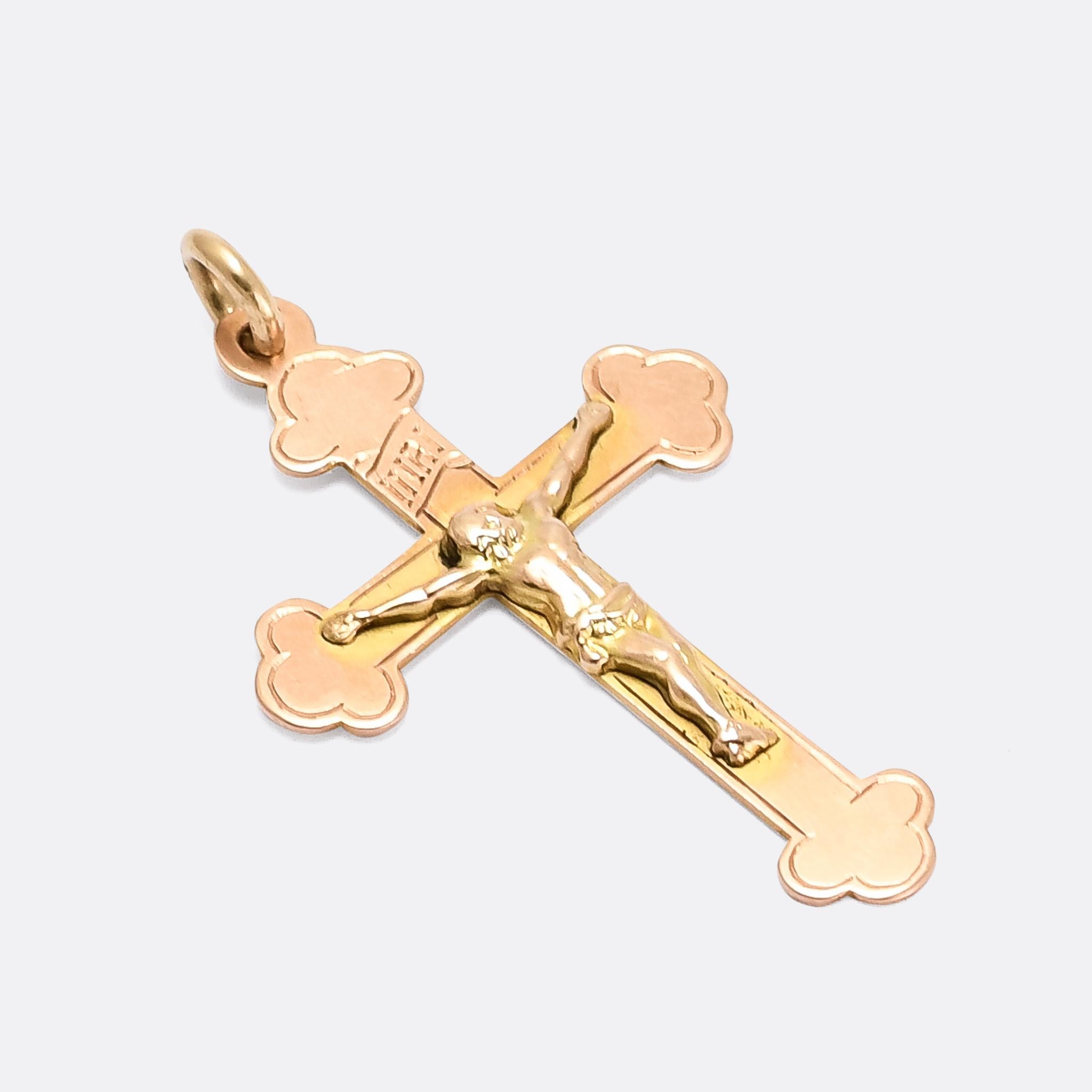 A superb antique crucifix pendant in 9 karat gold. It dates from 1918 - as per the Birmingham hallmarks to the reverse - and features the inscription INRI which represents the Latin inscription: IESVS NAZARENVS REX IVDÆORVM, or 