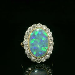 Anello antico edoardiano in oro e platino GIA con diamante opale nero a forma di aureola a basso profilo