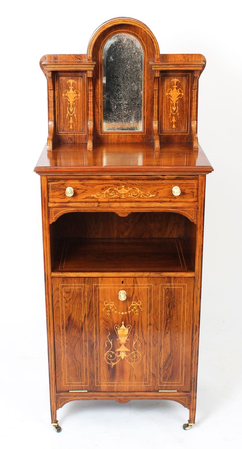 This is a beautiful antique Gonçalo alves and boxwood marquetry inlaid music cabinet, circa 1880 in date. 

The rectangular top has a mirrored marquetry gallery, above a single frieze drawer. The panelled cupboard door slides outwards and has