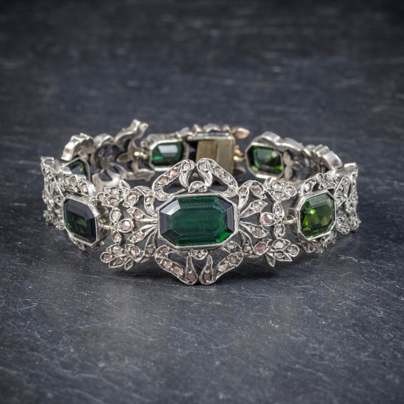 This stunning antique Green Tourmaline and Diamond bracelet is Edwardian, Circa 1910. 

The lovely grassy green Tourmaline’s graduate in size with 4ct stones at either end leading to a grand 6ct Tourmaline in the centre. 

There are also approx.