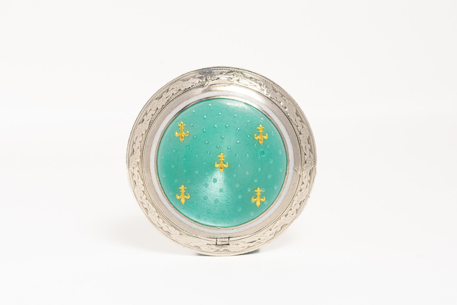This rare Edwardian light blue silver guilloche enamel compact is dated for 1907 and it was made in France. This extraordinary piece is decorated with striking light blue guilloche enamel and gold 'Fleur de Lis' motif. 'Fleur de Lis' is a French