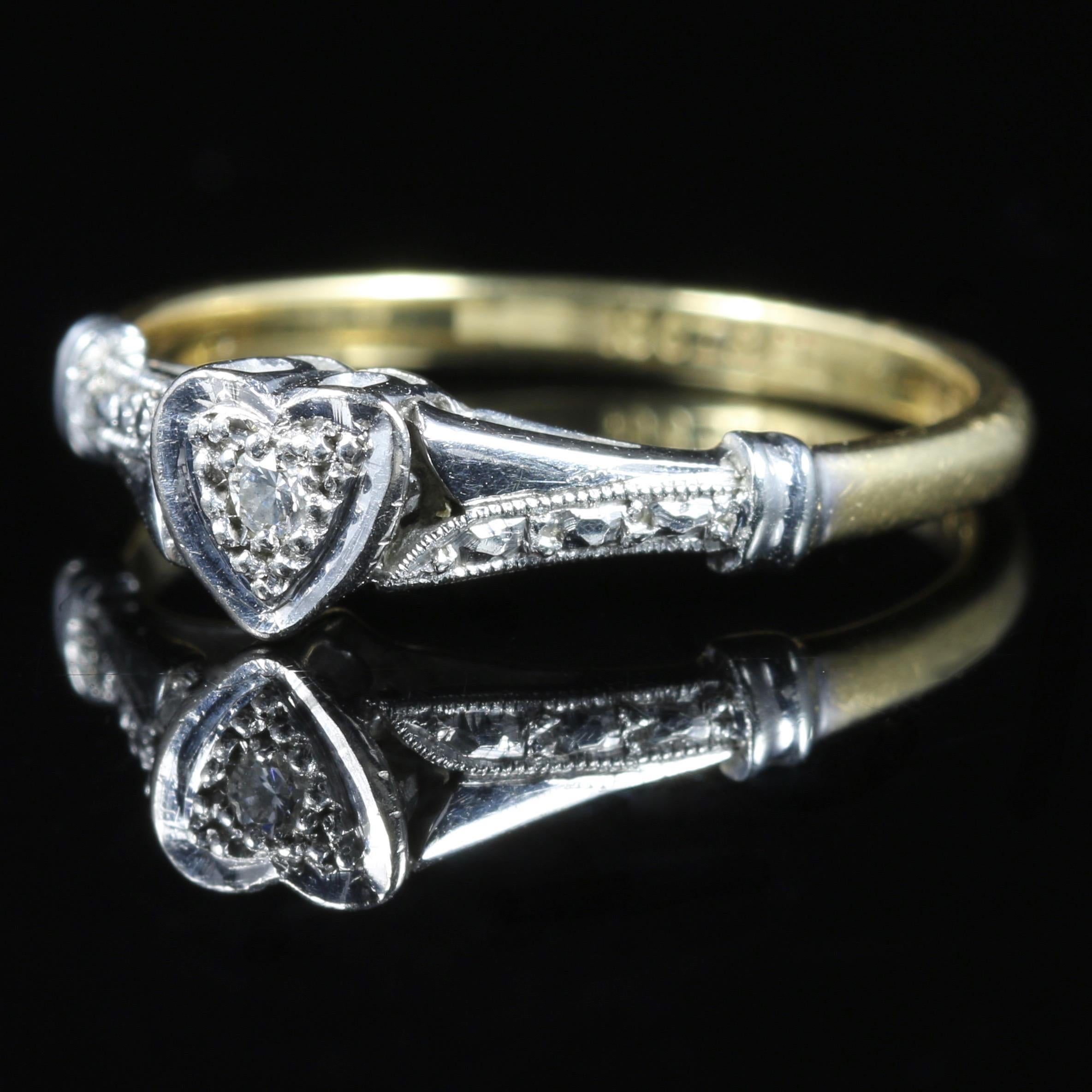 For more details please click continue reading down below...

This fabulous antique Edwardian Diamond heart ring is set in a twist gallery, Circa 1915.

Crowned with a small central Diamond in the heart.

Smaller Diamonds also chase down the