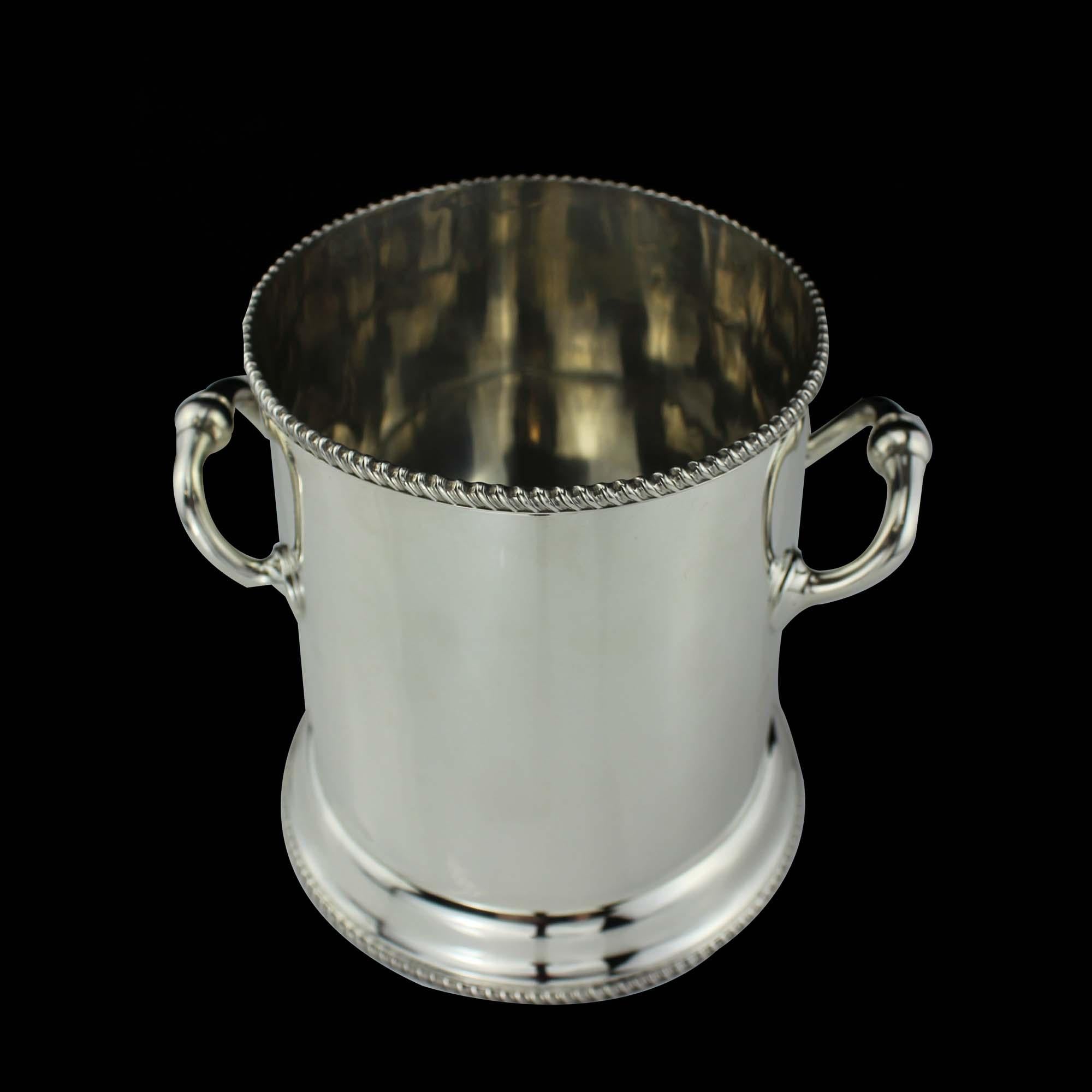Antique Edwardian ice bucket 

 Maker: Atkin brothers
 Made in: England, Sheffield, 1905
 Fully hallmarked.

 Dimensions - 
 Diameter x height: 13.5 x 15 cm 
 Weight: 539 g

 Condition: Item is in general usage , has age related wear and