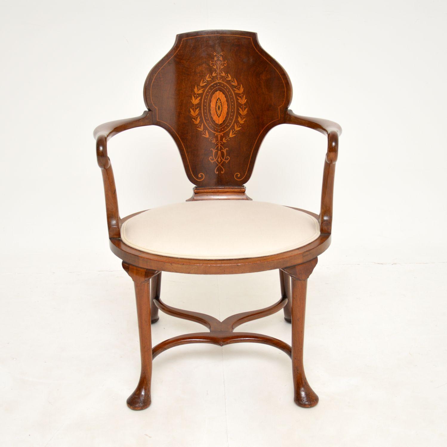 A superb antique Edwardian armchair. This was made in England, it dates from around the 1890-1900 period.

It is of very fine quality and has a stunning design. The frame is not too imposing, with a beautifully shaped back, stunning curves on the