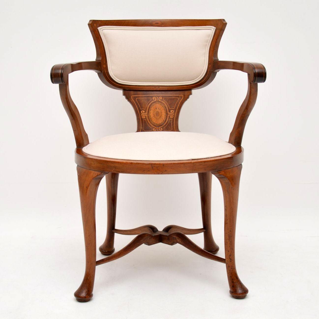 I believe this antique armchair would be a perfect candidate for a desk chair, because the arms are set back a bit from the seat front. This chair is solid mahogany, with exquisite satinwood & other inlays inside the back & on the arms. It’s
