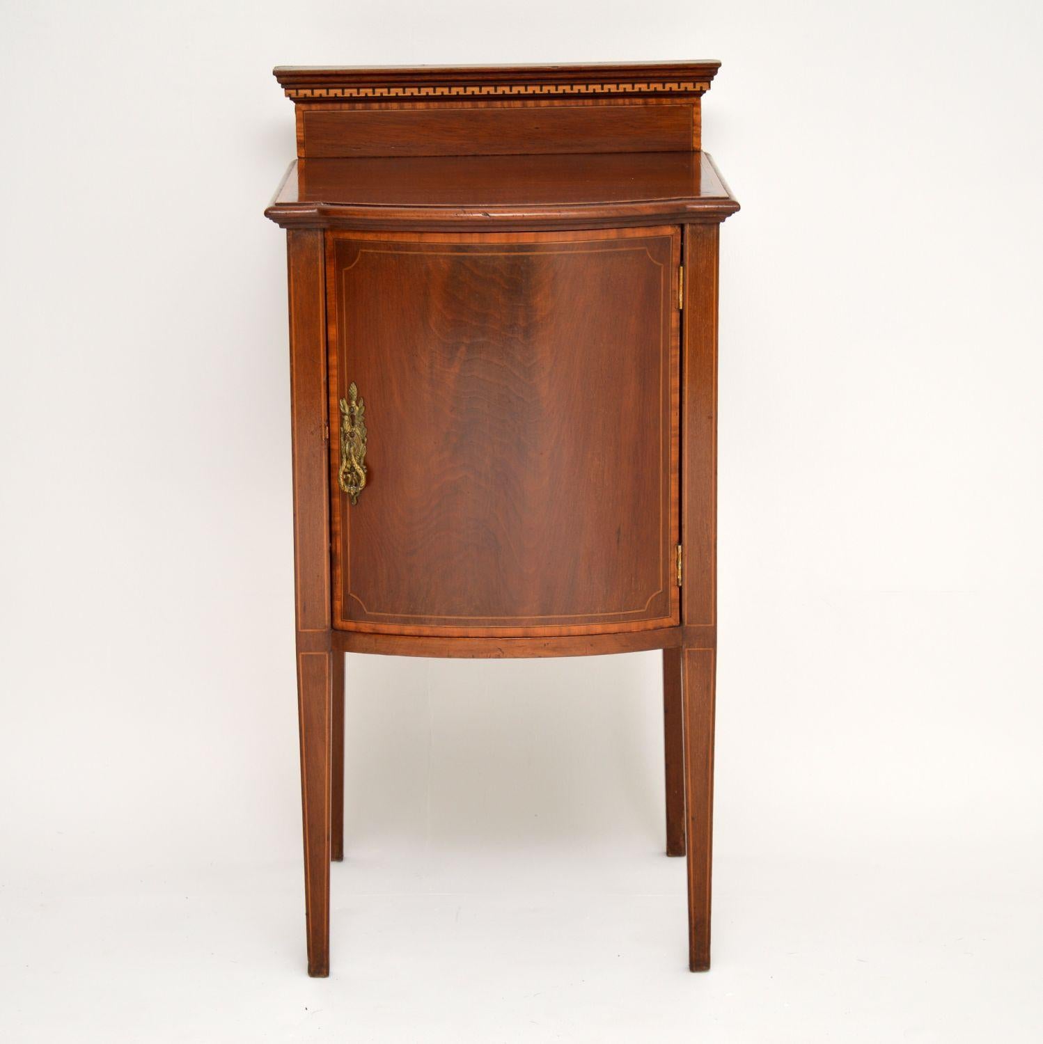 Antique Edwardian bow fronted bedside cabinet in mahogany with some fine satinwood inlays. This cabinet which dates from circa 1900-1910 period is in good condition, having just been French polished and could be very useful anywhere in the