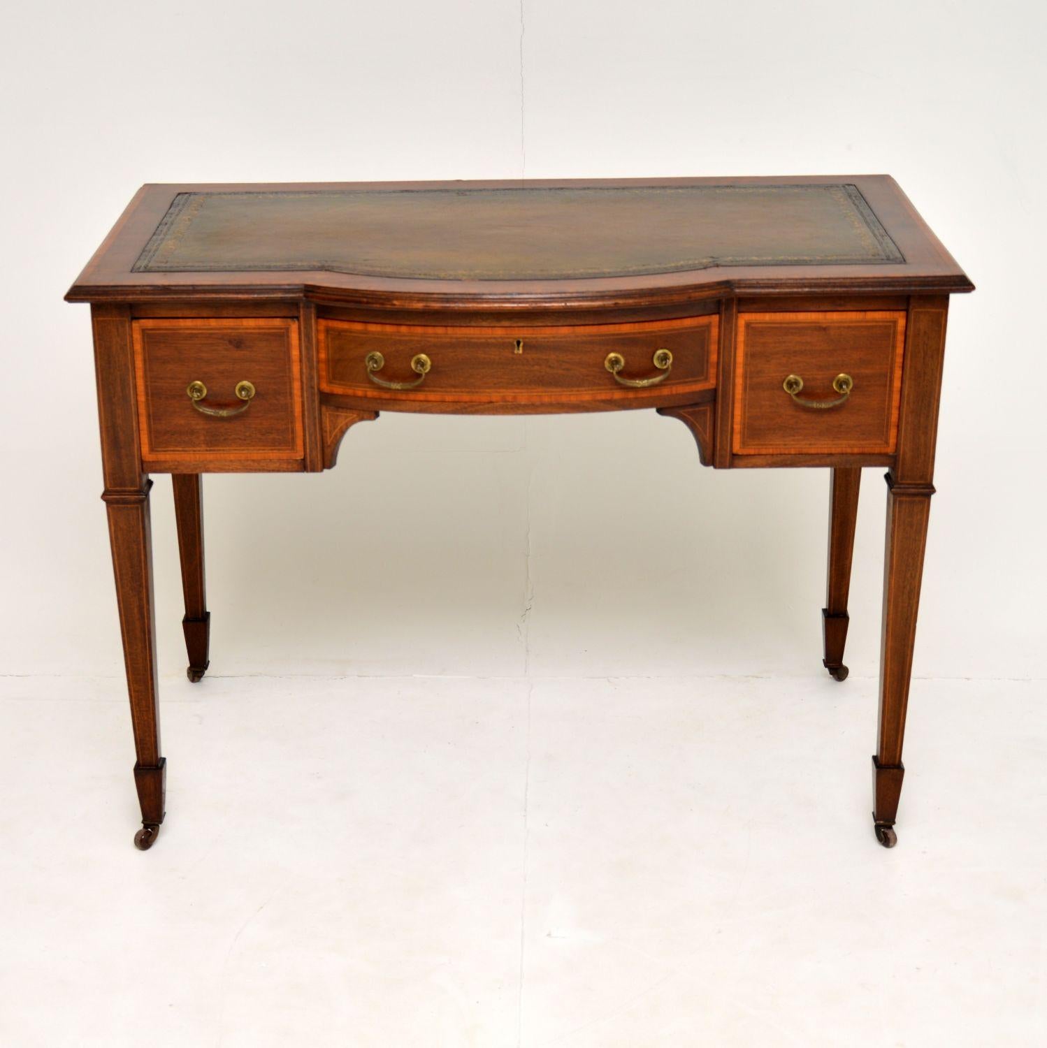 A stunning antique writing table, beautifully made from mahogany inlaid with satin wood. This dates from circa 1890-1900 period, and it was made by Maple & Co. This is actually stamped into the drawer and not a label.

We have had this French