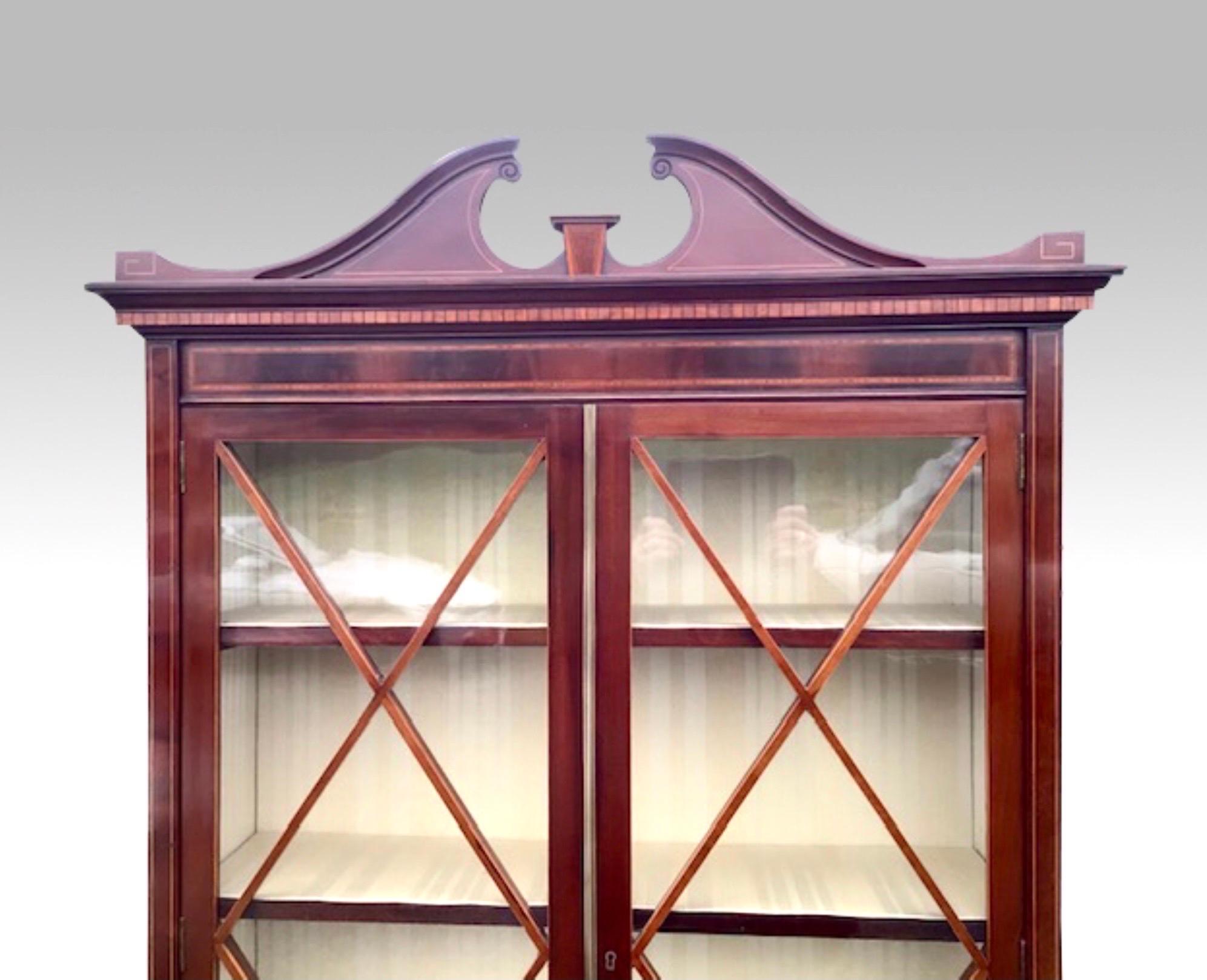 Super fine quality antique Edwardian inlaid mahogany narrow cabinet, bookcase
Superb Oval Panelled Doors
Beautifully upholstered interior.
Good storage under display.
c1895 
Measures: 89 ins x 37 ins x 17 ins.
 
