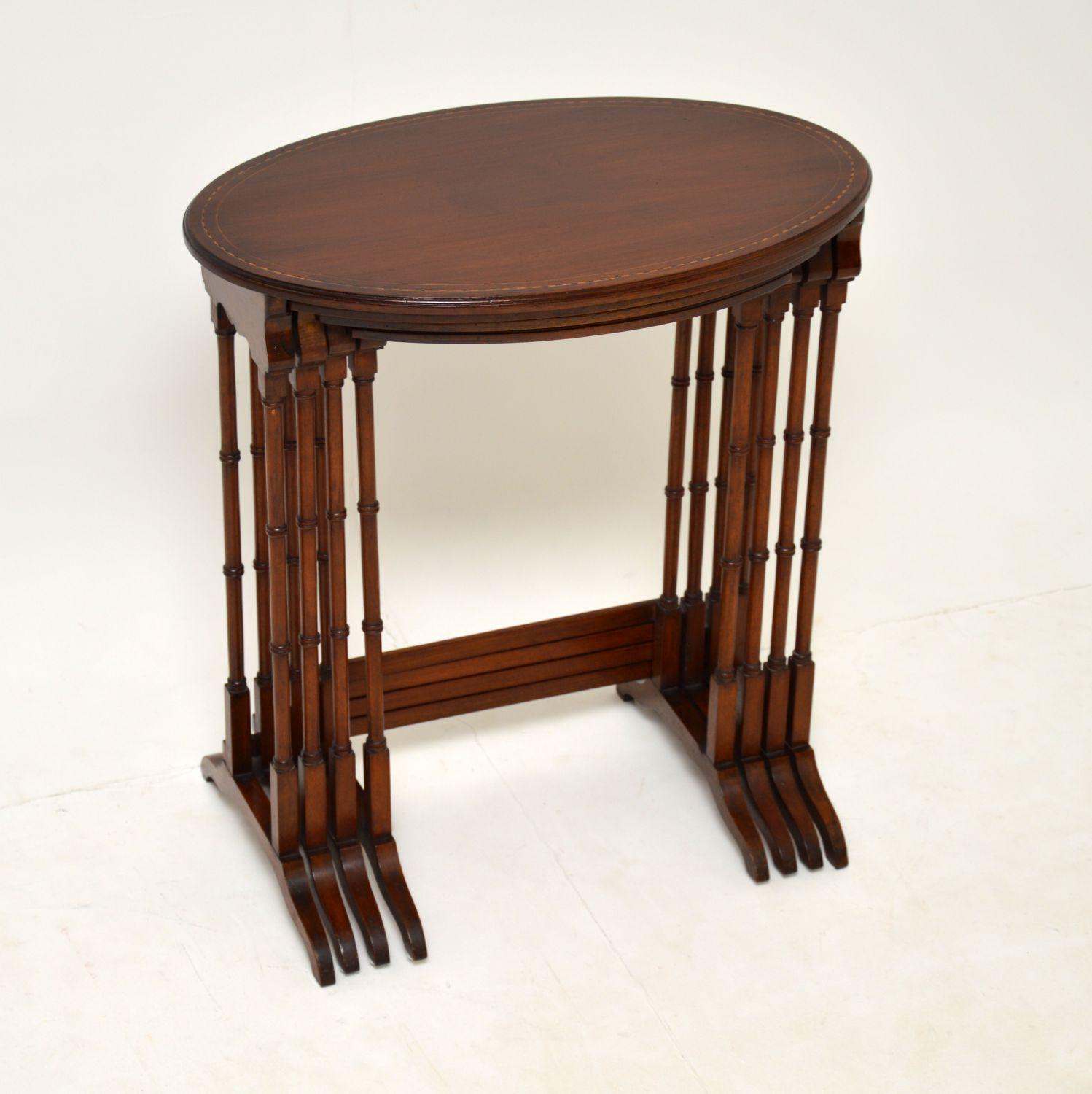A beautiful and elegant Edwardian nest of four tables. They date from around the 1900-1910 period.

The quality is excellent and these have a lovely design. The solid mahogany tops are inlaid with satin wood, they have a gorgeous colour and