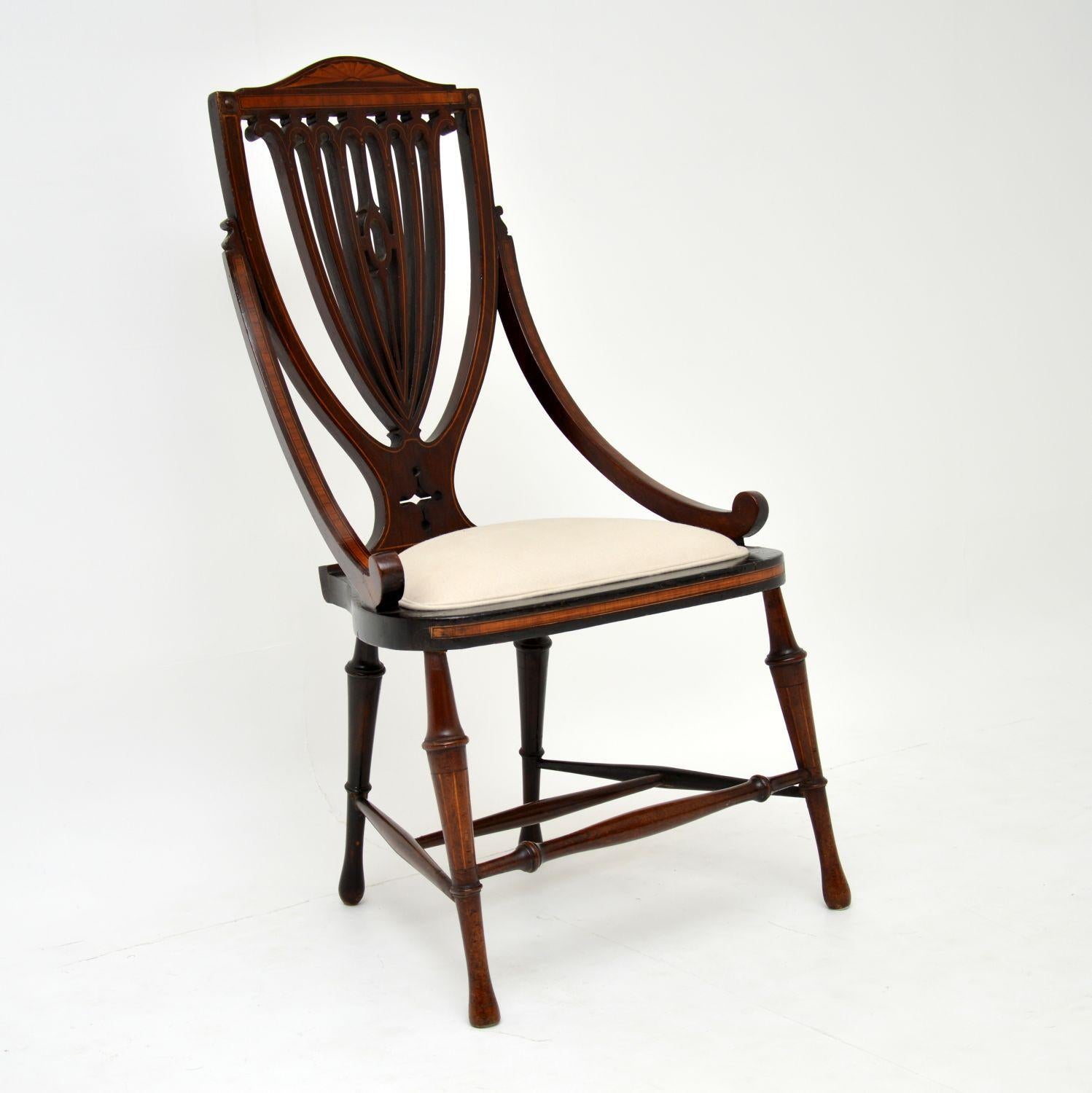 This antique Edwardian mahogany side chair has some wonderful features and exquisite decoration.

It’s in very good original condition, having just been French polished and re-upholstered in our regular cream natural cotton fabric. The seat area