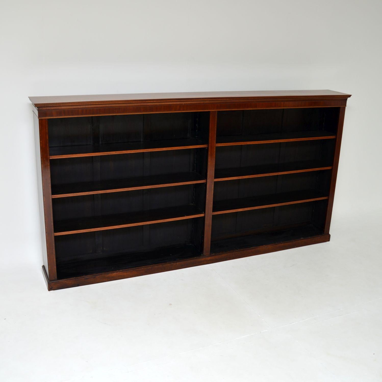 A large and impressive antique Edwardian open bookcase. This was made in England, it dates from around the 1890-1910 period.

It is of superb quality and is a great size. It is very wide, not too high and not too deep, so though it contains lots of