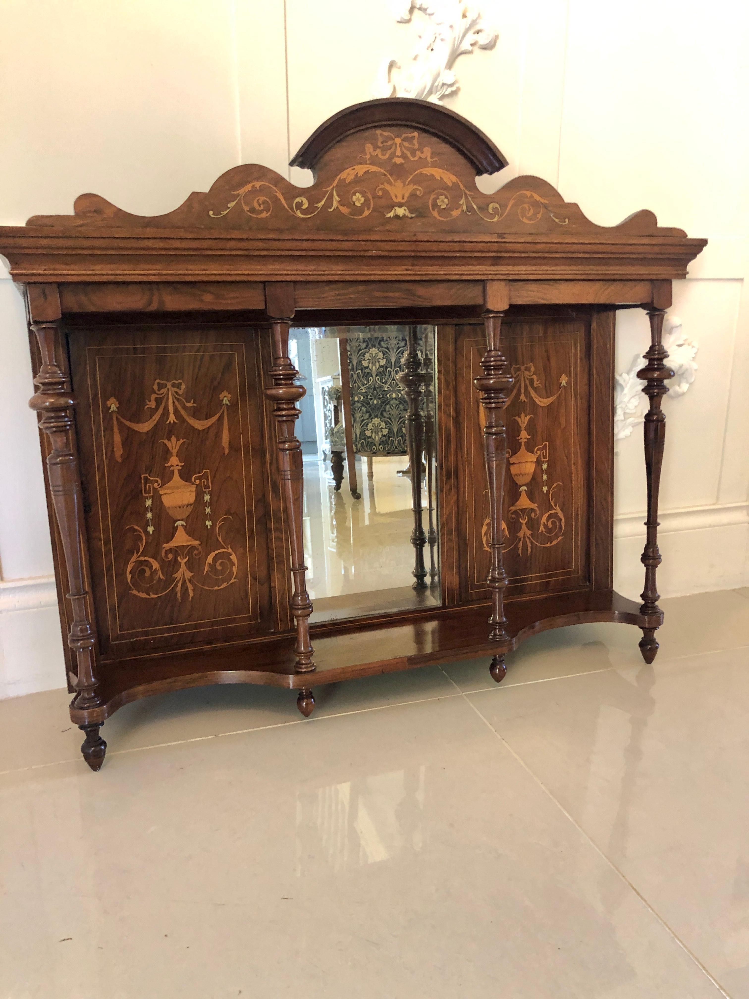 Antique Edwardian inlaid rosewood overmantel mirror having an attractive inlaid rosewood swan neck pediment, bevel edged mirror to the centre, one shaped shelf supported by turned columns with original turned finials, superior inlaid rosewood panels