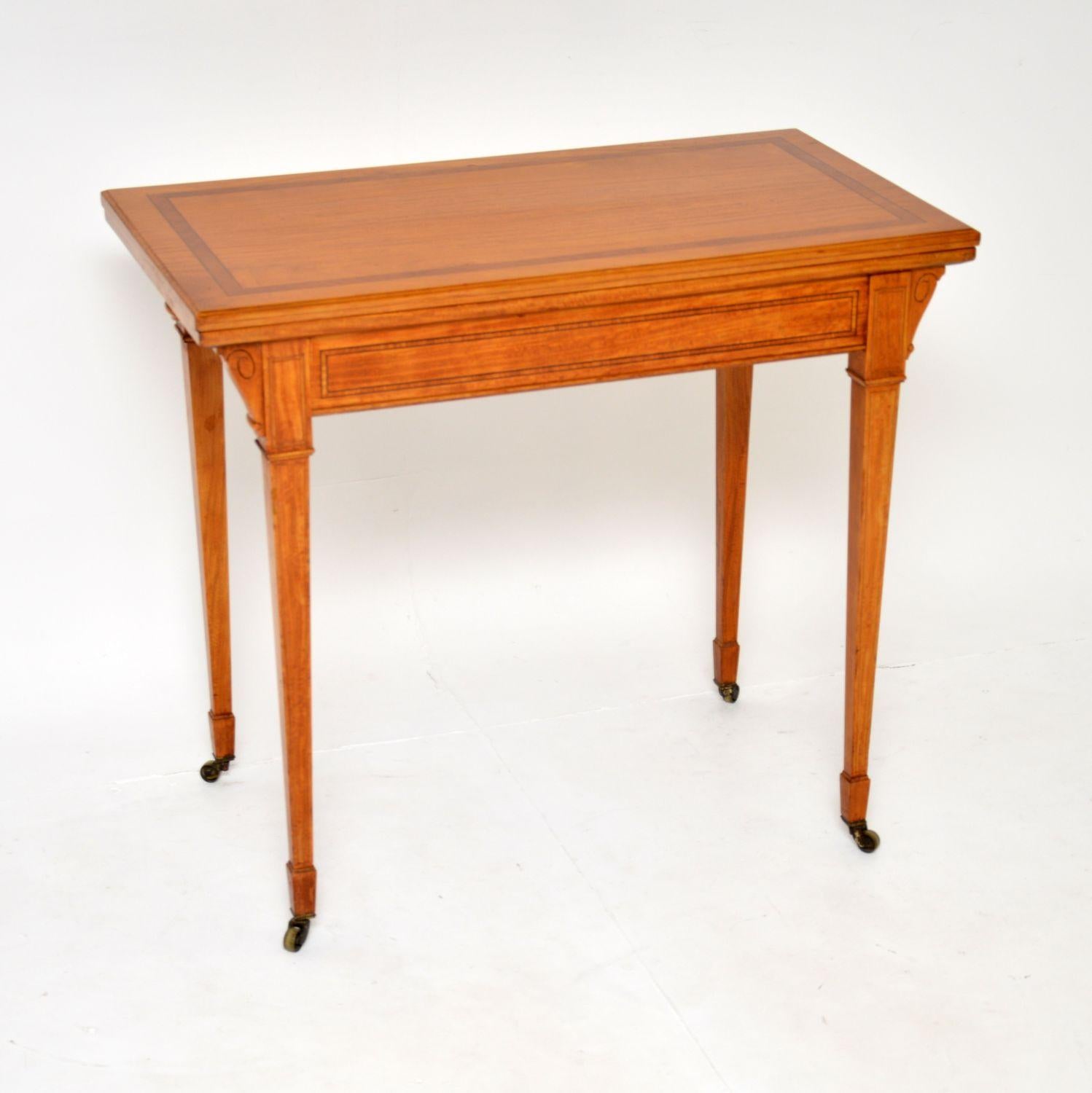 A wonderful antique Edwardian card table, beautifully made from satin wood. This was made in England, it dates from around 1900-1910.

The quality is excellent, this is very well made and has a very elegant design. The satin wood has stunning colour
