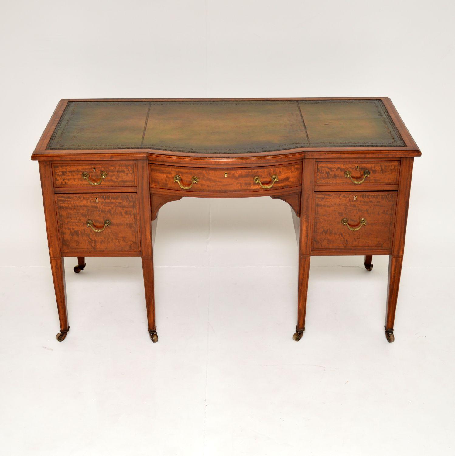 An excellent original antique inlaid satin wood desk with an inset leather top. This was made in England, it dates from around the 1890-1910 period.

This is beautifully made and is of amazing quality. The makers stamp ‘H. Mawer & Stephenson’ is